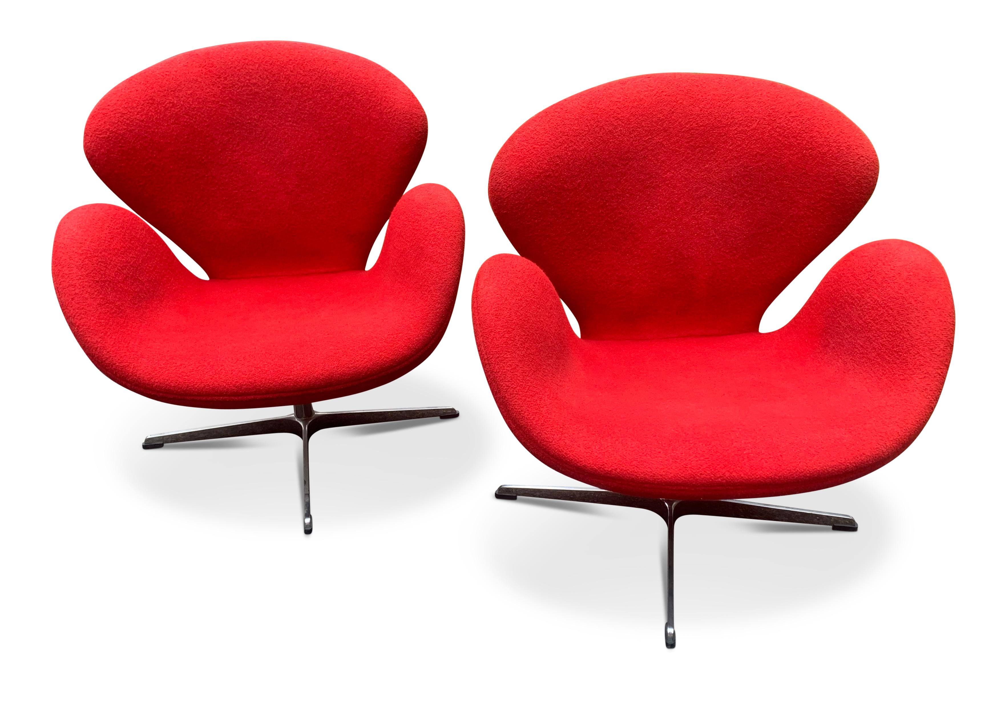 Arne Jacobsen Swan Chair (no labels) in Red Upholstery on a Four Star Metal Base 
Arne Emil Jacobsen, usually known as Arne Jacobsen, (11 February 1902 to 24 March 1971) was one of Denmark’s most successful architects and designers. In particular,