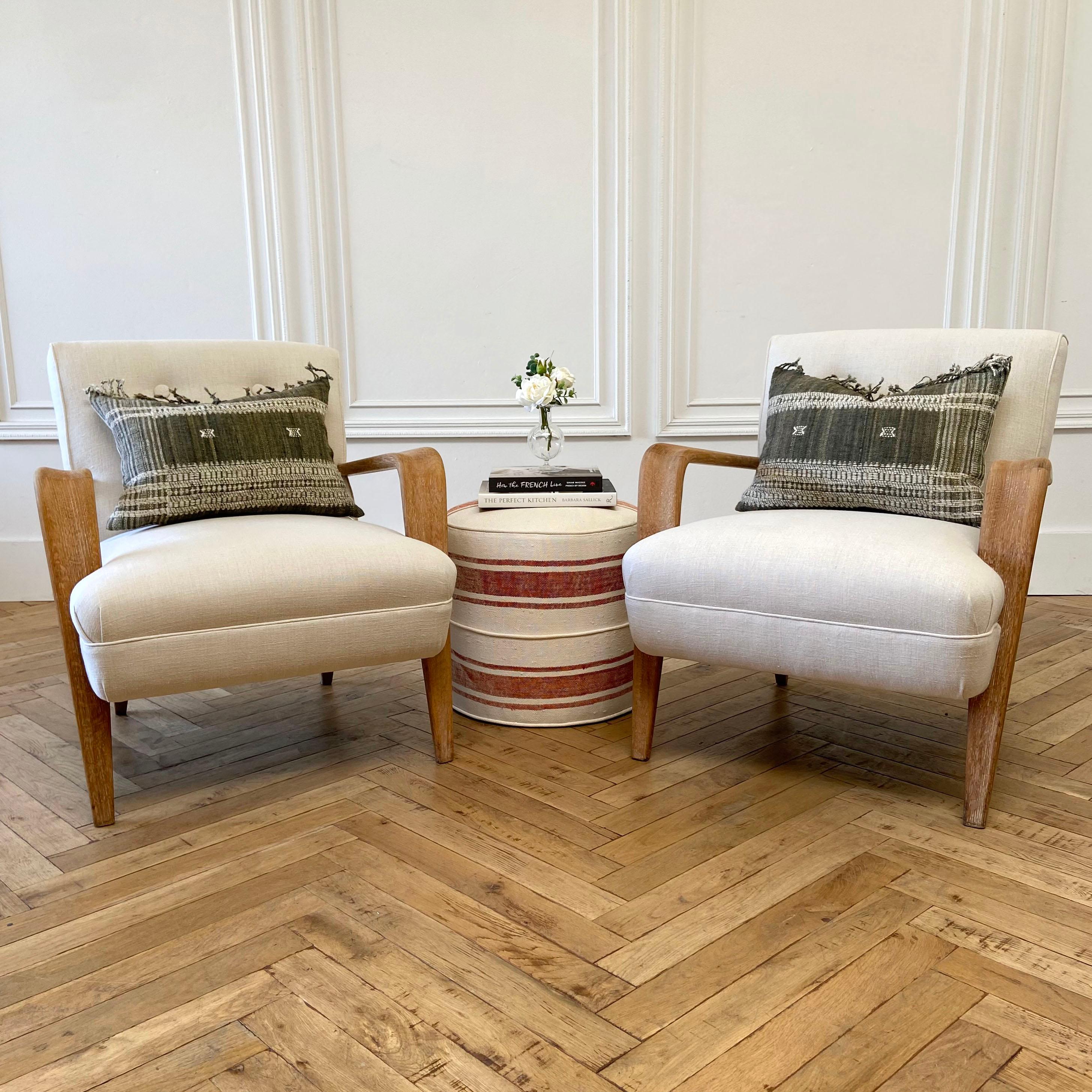 Pair of vintage Mid-Century Modern upholstered chairs with white oak frame
Upholstered in our 100% organic natural Libeco Linen, with original style upholstery with button back, and welt trim. These arms and leg frame have a stripped wood finish,