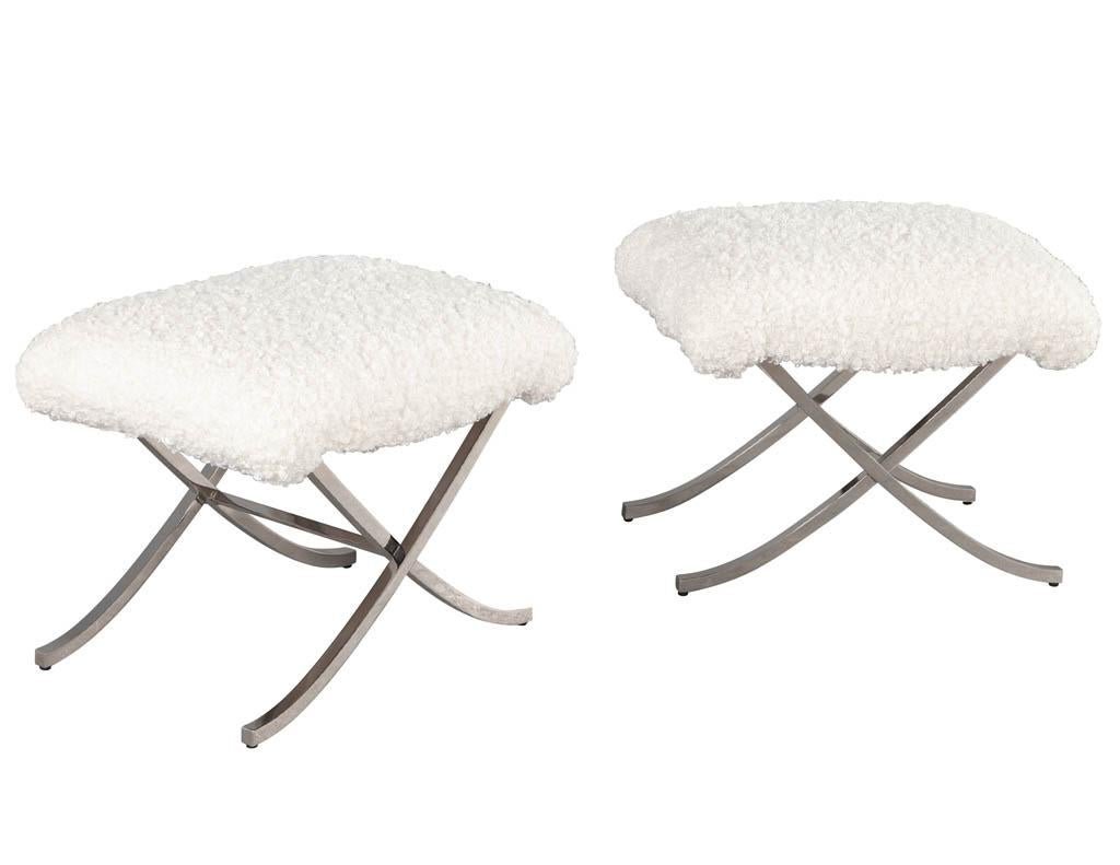 Pair of vintage Mid-Century Modern X base stools. Polished stainless steel X base stools newly upholstered in a Boucle fabric.

Price includes complimentary scheduled curb side delivery service to the continental USA.