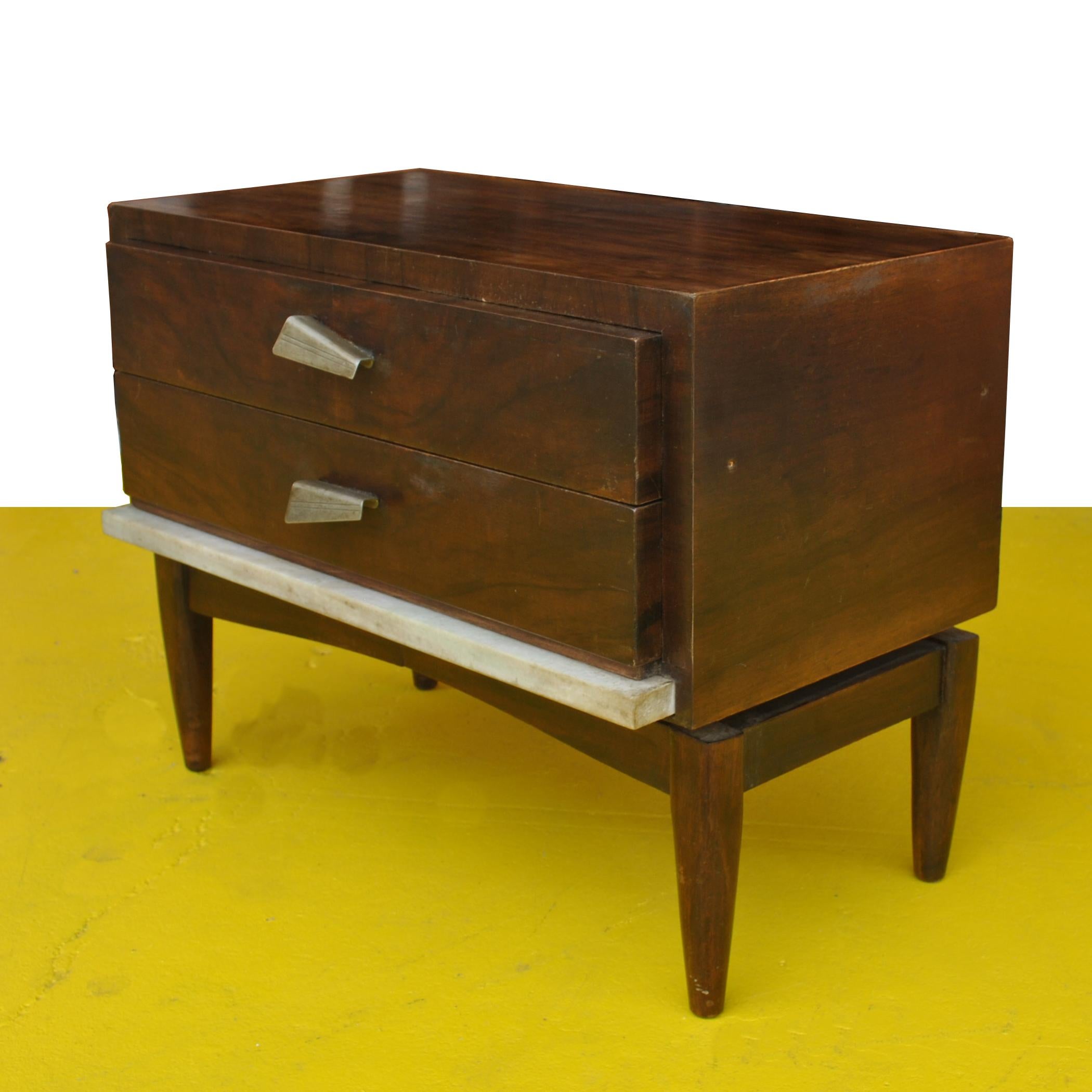 Pair of vintage midcentury nightstands

Beautiful nightstands or side tables from South America.. Rosewood with marble trim and metal pulls. 
Two drawers. 

22.25
