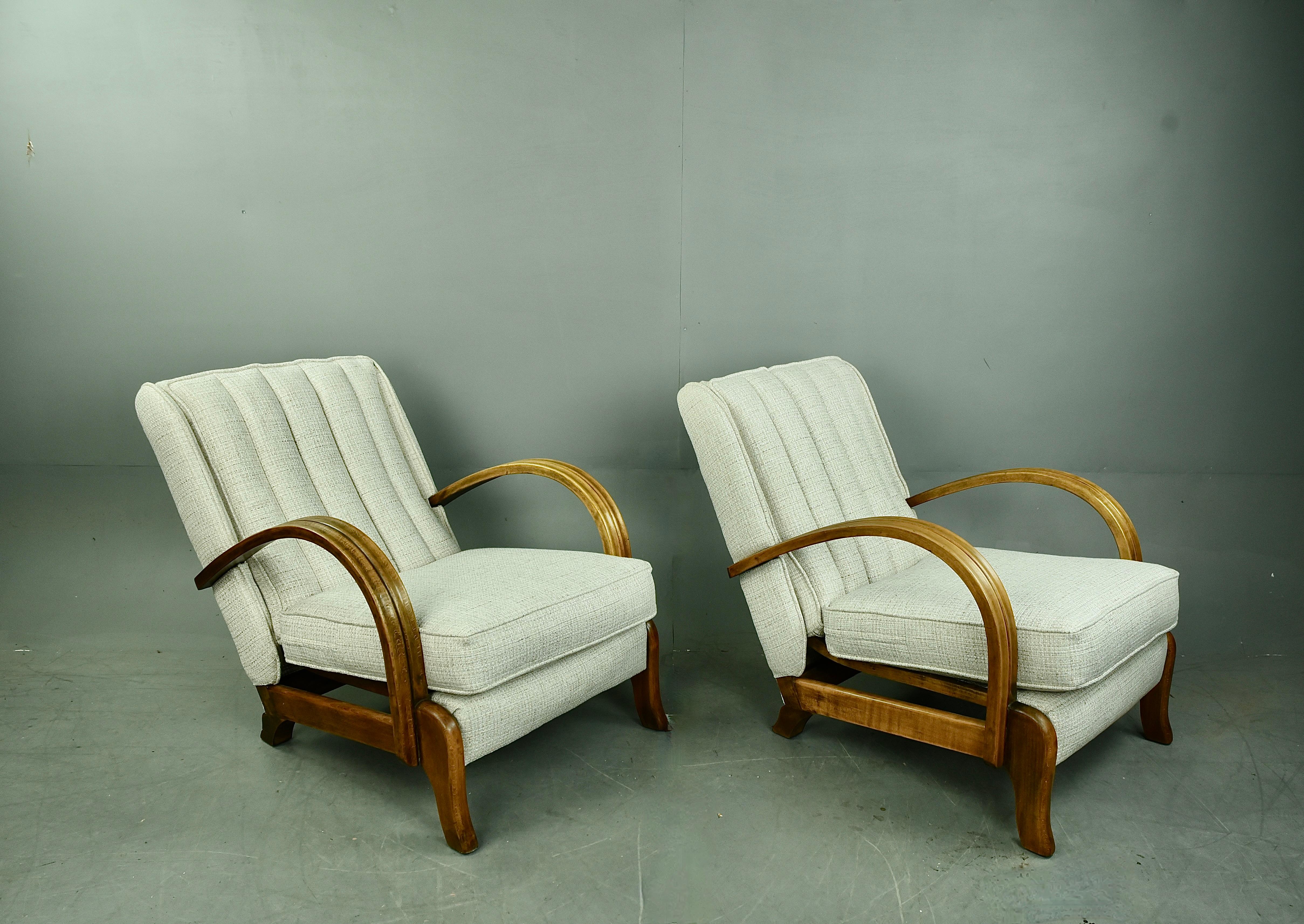 Very Rare pair of mid century Lazy chairs by M.B & S Ltd Leigh on sea Essex .
The chairs are unique in construction with a floating spring construction to the base and backs , They have wonderfully formed solid beech bentwood arms (not plywood like