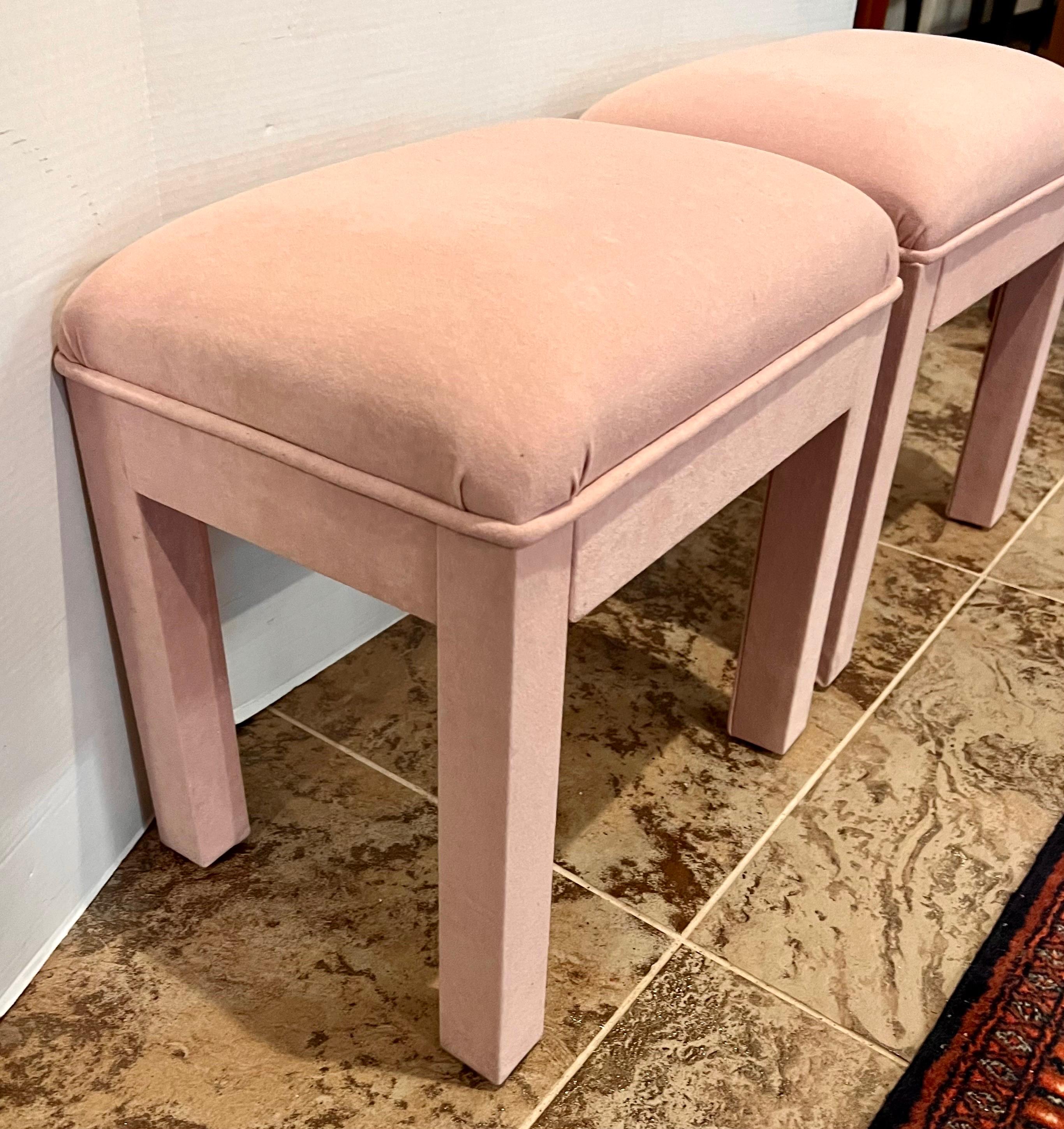 Pair of vintage parsons stools upholstered in a pink velvety fabric.
Great for extra seating and adding style to your space.