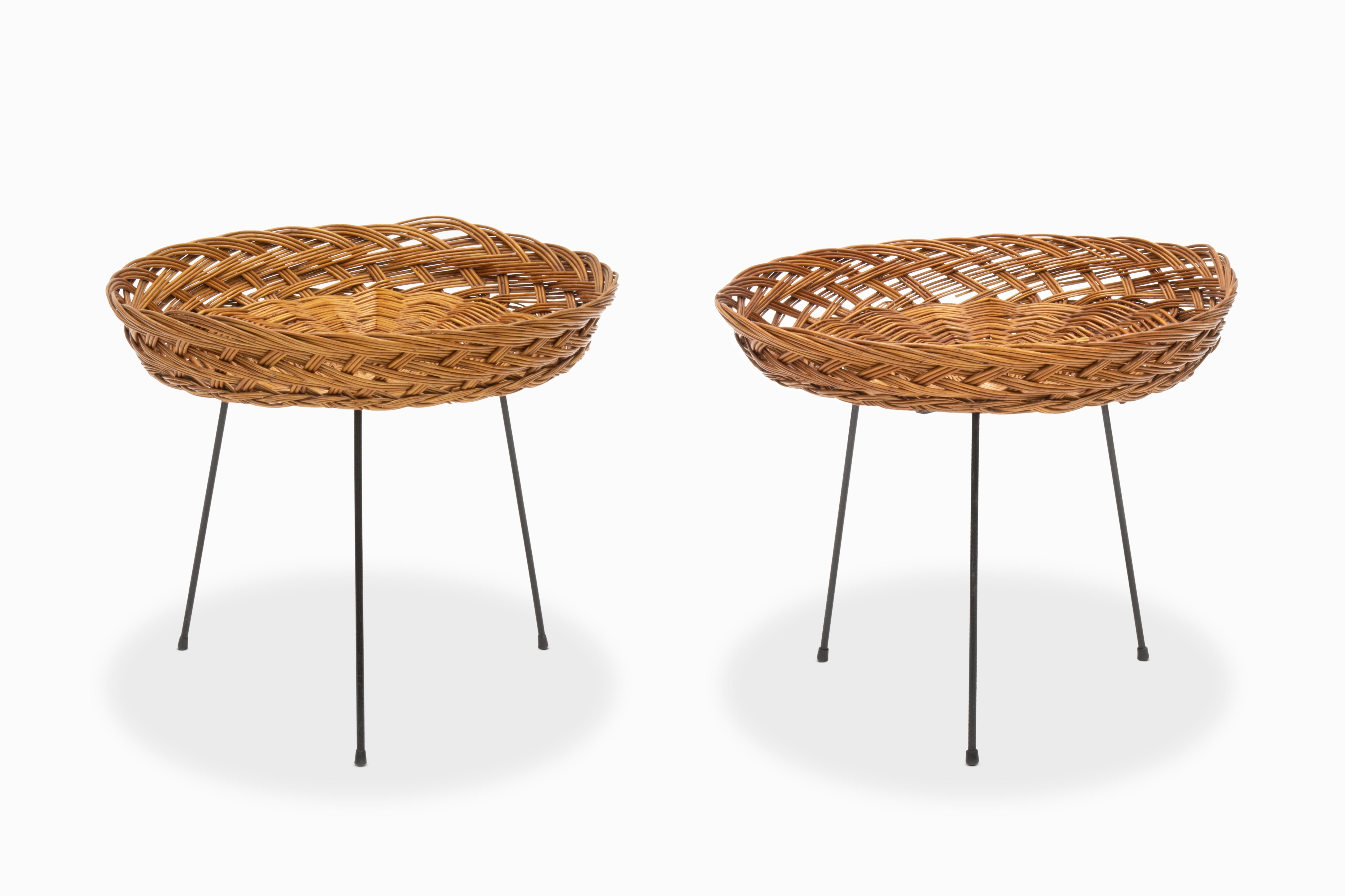Here is a wonderful pair of rattan side tables with wrought iron tripod bases.  Their origin is unknown, perhaps French or Italian, but their charm is undeniable, right down to the slotted hardware and wingnut fastener.  They are in good overall