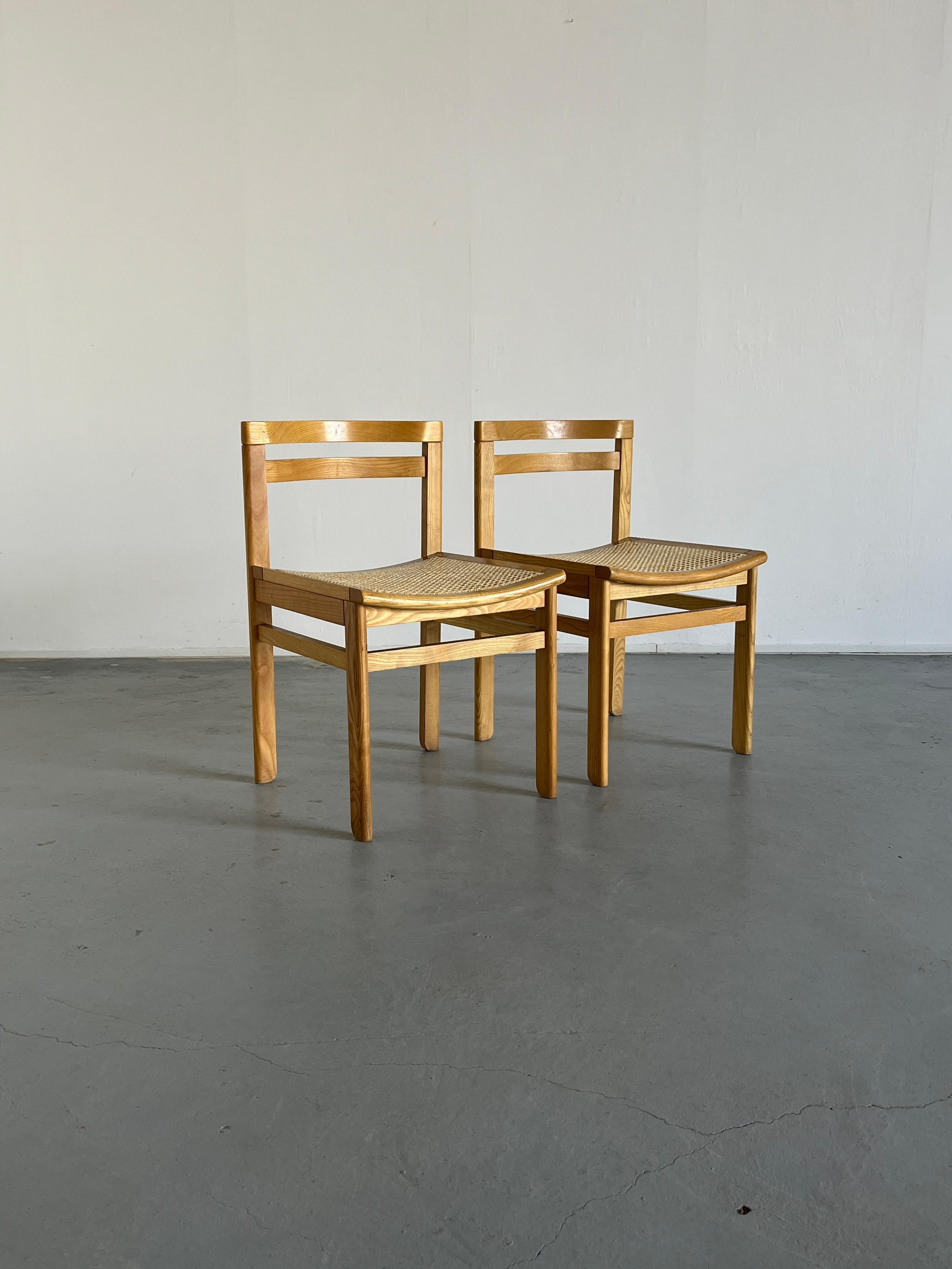 Beautiful and elegant wood and cane Mid-Century-Modern constructivist dining chairs, in European beechwood and with wicker cane seat. Elegant and simple design. Would fit well in a natural soft interior with nude tones and hints or rustic modern