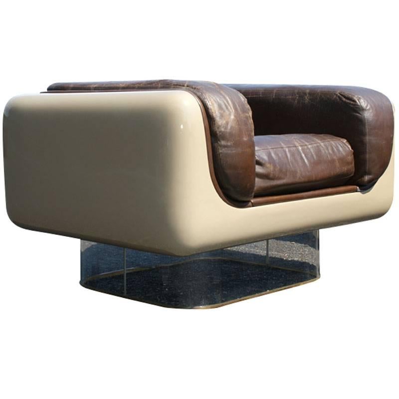 The soft seating line was introduced in May 1972,. 
Seats are designed to give firm back support and soft comfort to the body’s contours. 

Armchairs:
Tan fiberglass body 
Mounted on clear acrylic bases 
Soft original chocolate brown leather