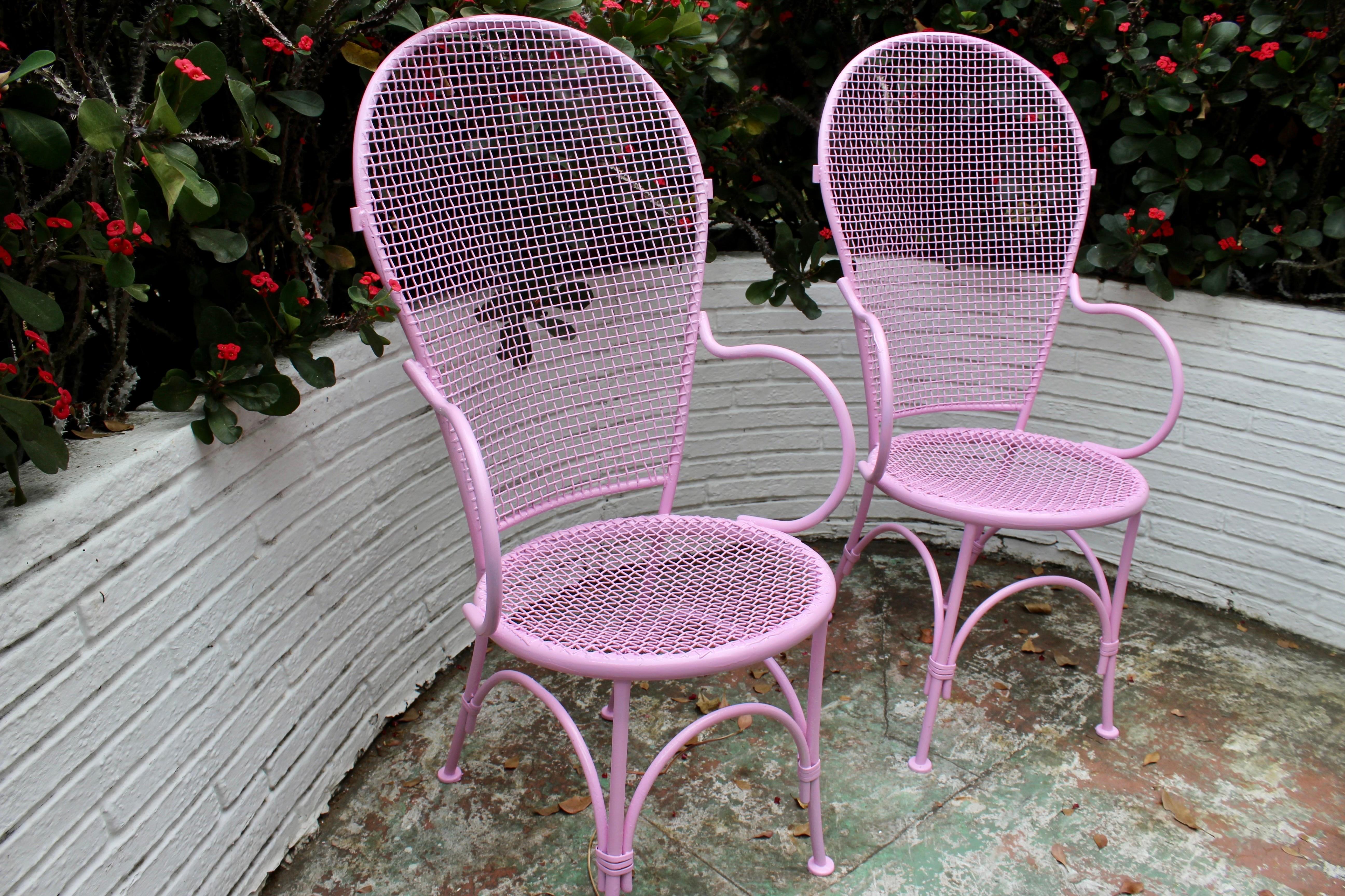 Pretty in Pink! Pair of beautifully restored vintage Midcentury modern Russell Woodard tall back arm chairs. These stunning chairs consist of metal with a tall back and curved arms with matching curved seat and detailed curved legs. If you have any