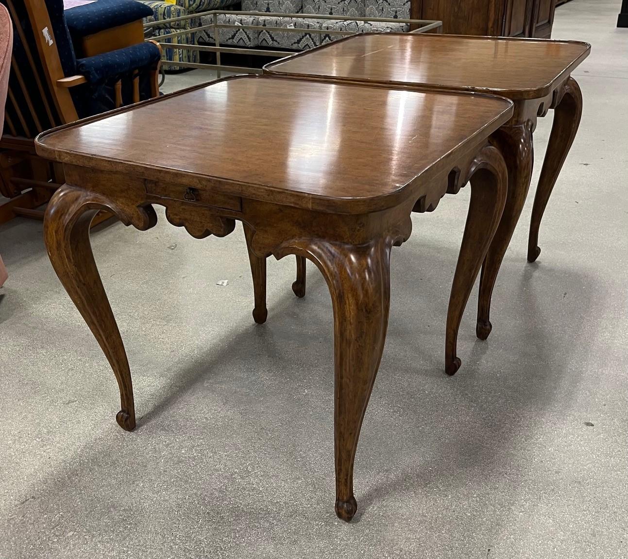 Pair of Vintage Minton Spidell Louis XV Style Carved Walnut Tables

Crafted by Minton Spidell at the end of the 20th century, these beautiful square tables stand on elegant cabriole legs over scroll feet. The tables feature scalloped aprons and a