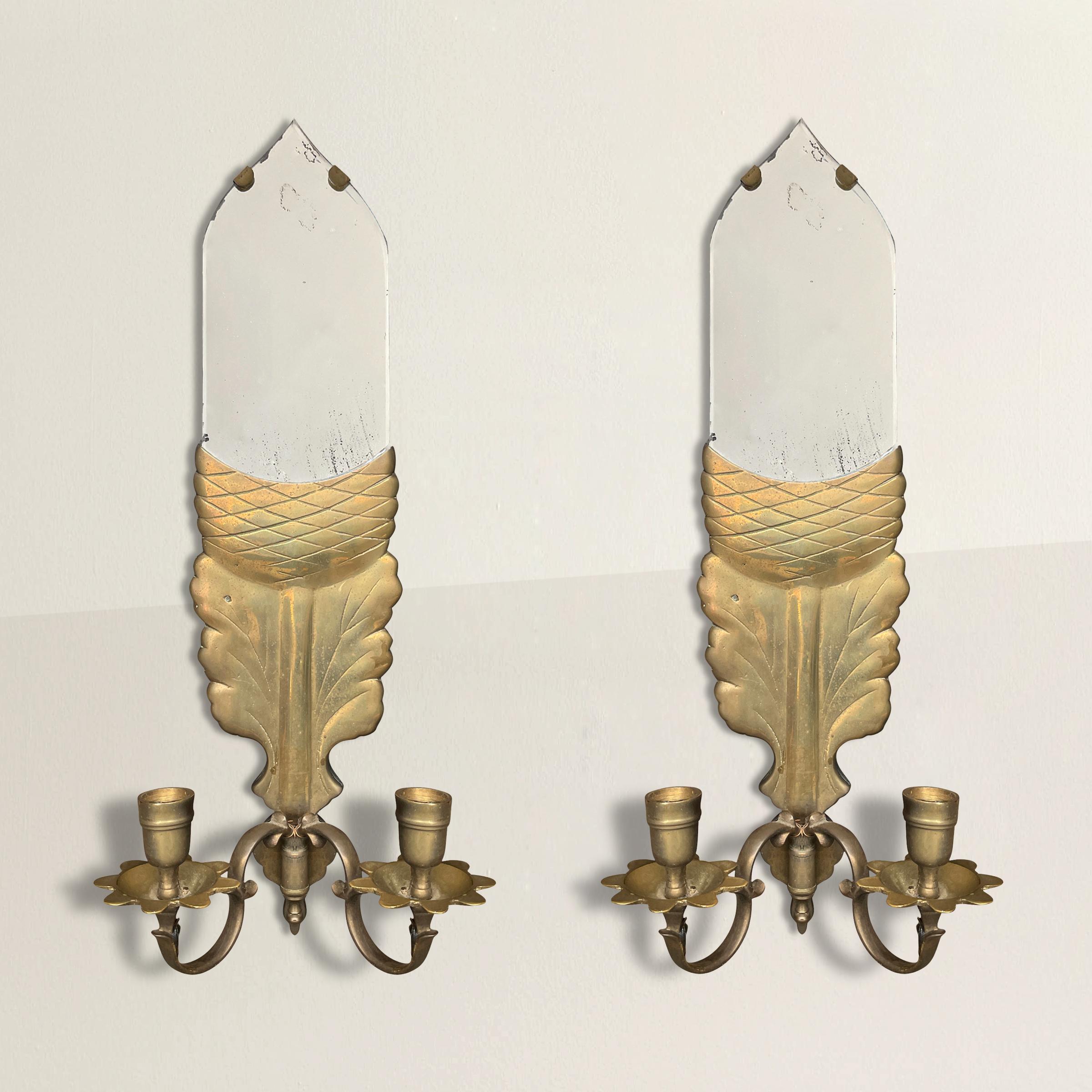 A wonderfully charming pair of 20th century candle sconces with mirrored acorns, oak leaf backplates, and scrolled arms. Sconces were once wired, but are no longer. Can be used with candles, or electrified once again.