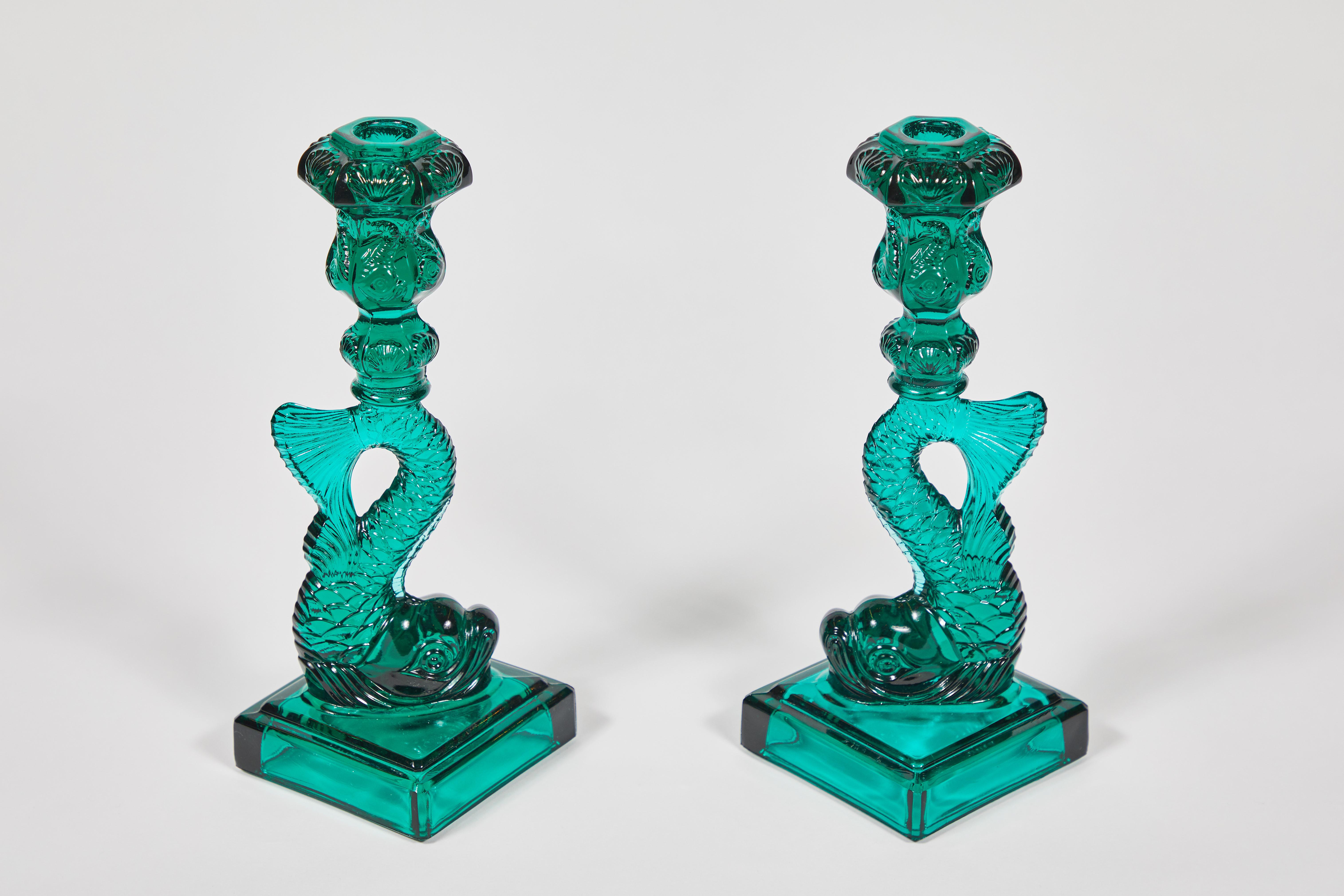 This 1970s imperial glass reproduction of a late 1800s dauphin candlestick design now qualifies as vintage itself. The Metropolitan Museum of Art Met Store sold limited edition sandwich glass style koi fish candlesticks in a range of colors; MMA is