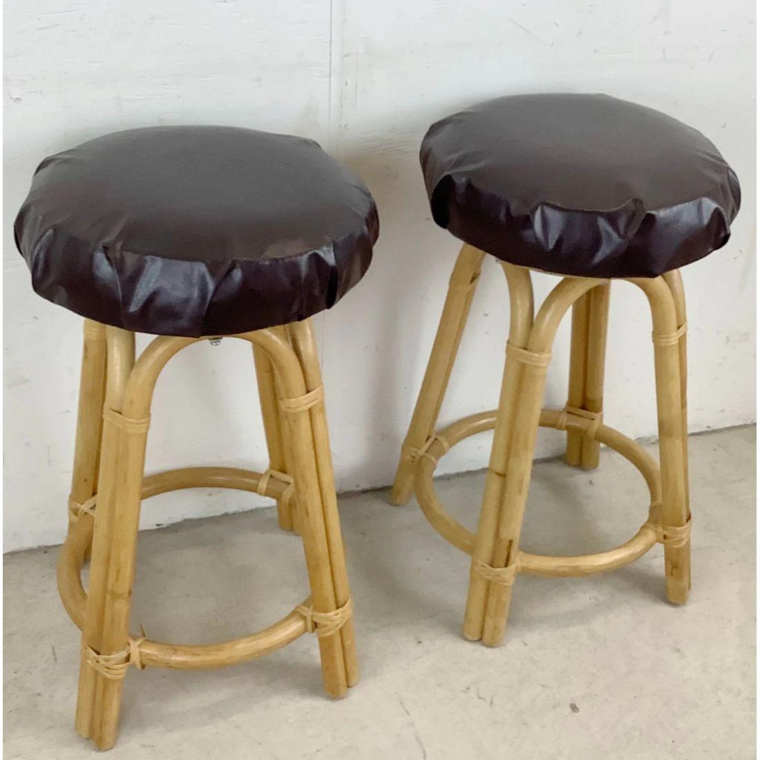 This stylish pair of boho modern swivel barstools stand at 28 inches tall, a uniquely versatile height for use with some counter heights as well as bar height- the simple bamboo construction frame is topped with a comfortable easily reupholstered
