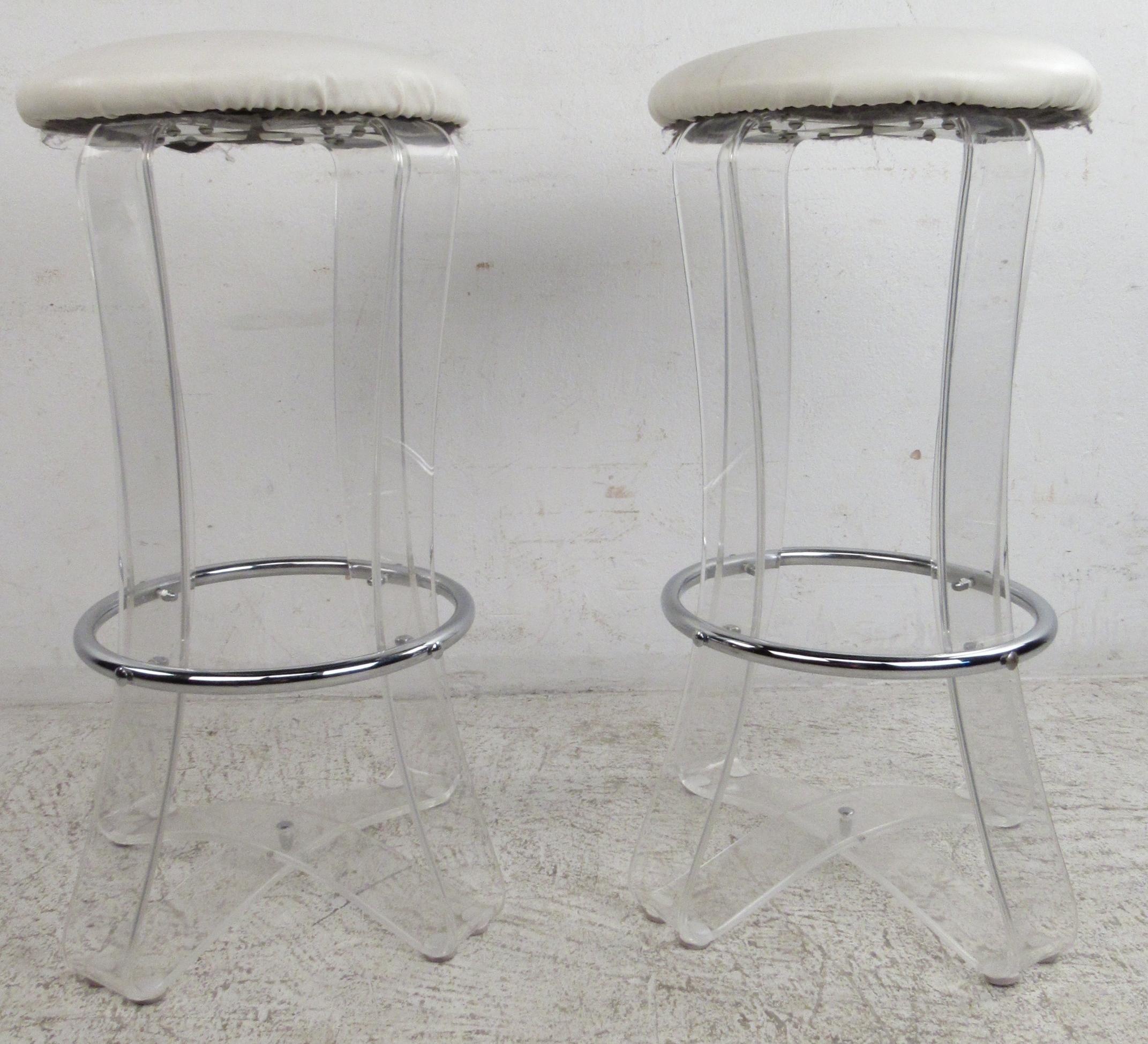 A pair of Mid-Century Modern bar stools. Their simple lucite and vinyl design are perfect for any setting. 

Confirm pickup location (NY/NJ).