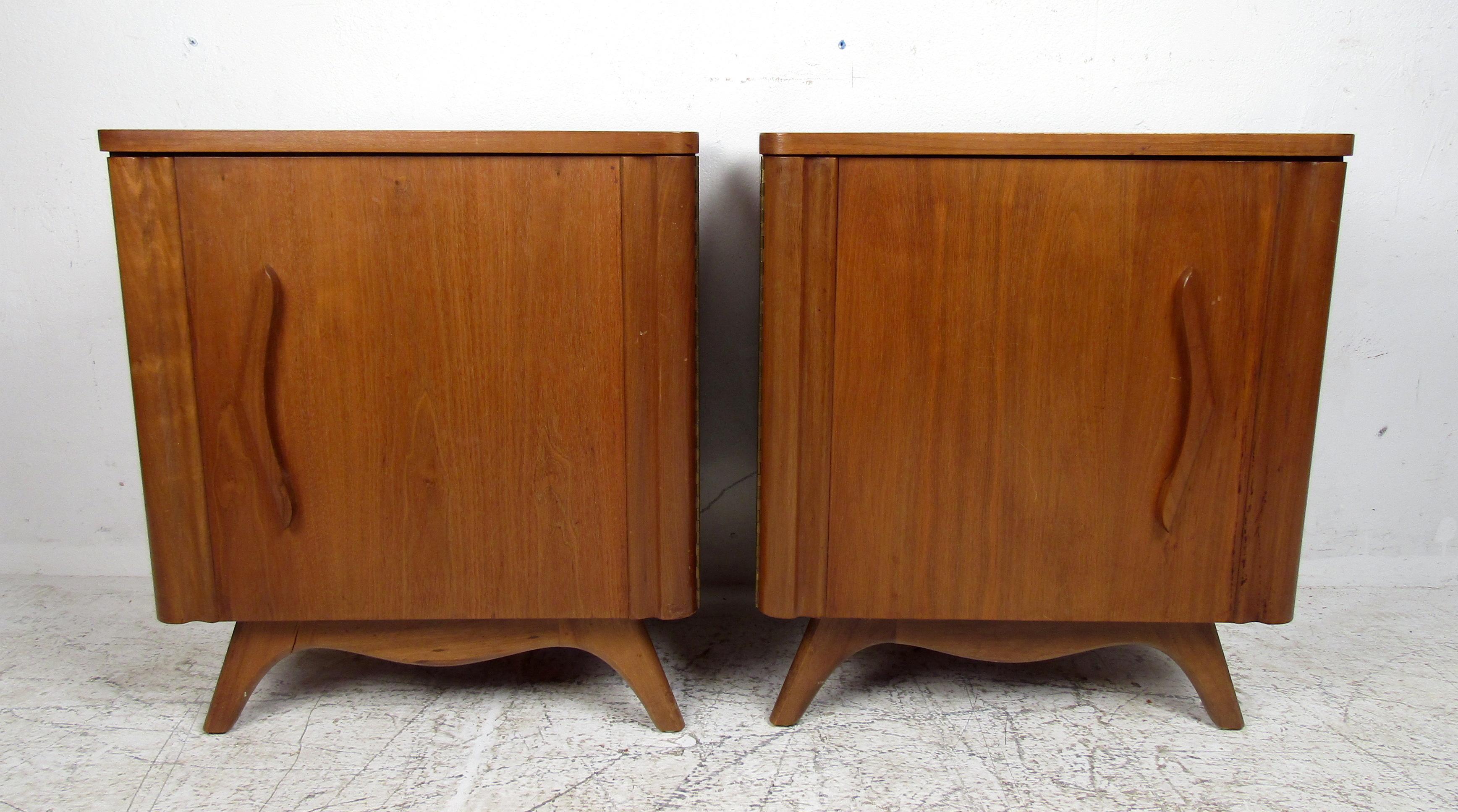 Mid-Century Modern pair of nightstands features one spacious storage unit with a shelf in rich walnut grain.

Please confirm the item location (NY or NJ).
  