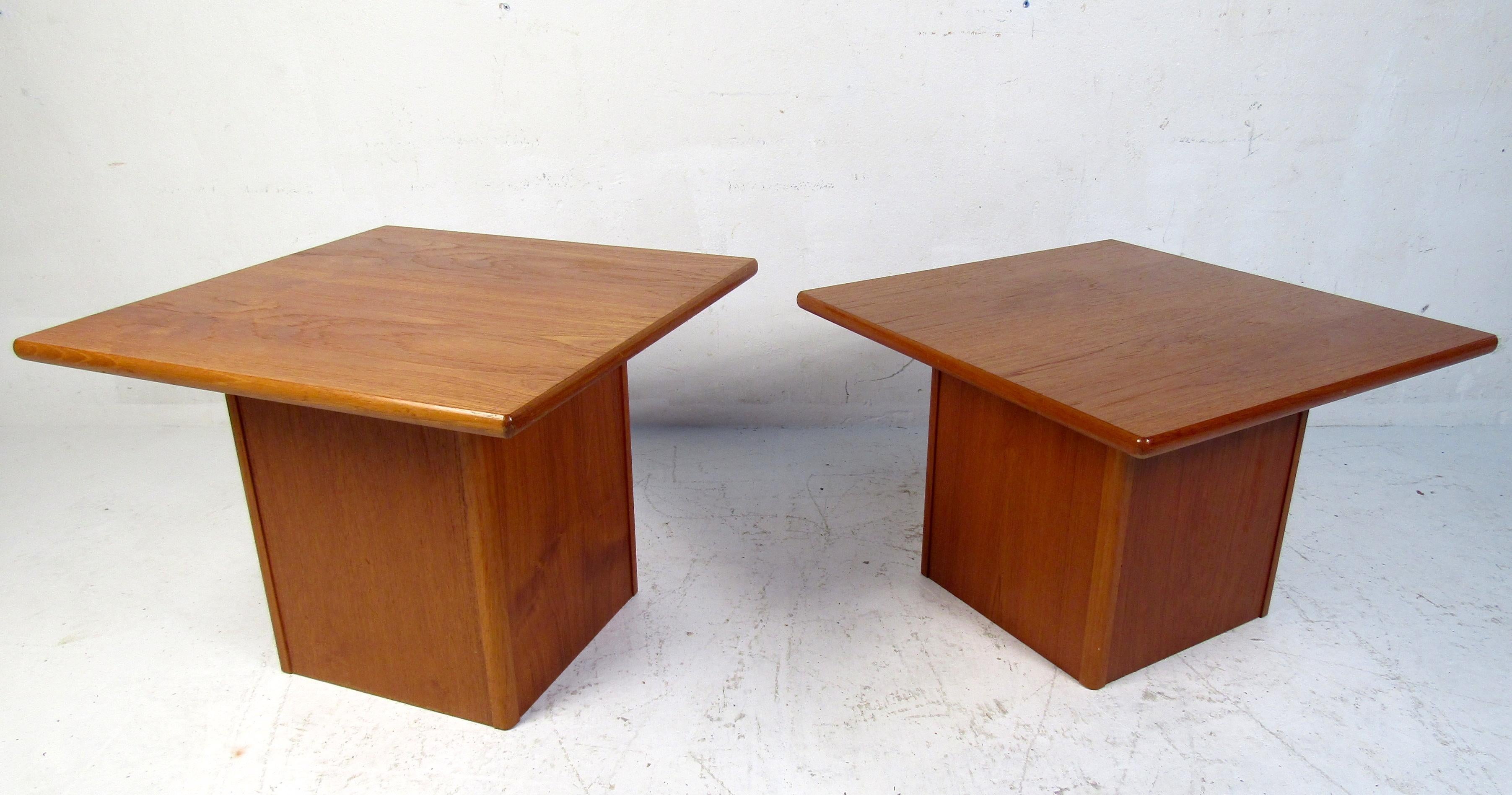 Mid-Century Modern pair of side tables featured in teak, these tables would make a great addition to any home or office.

Please confirm item location (NJ or BK).