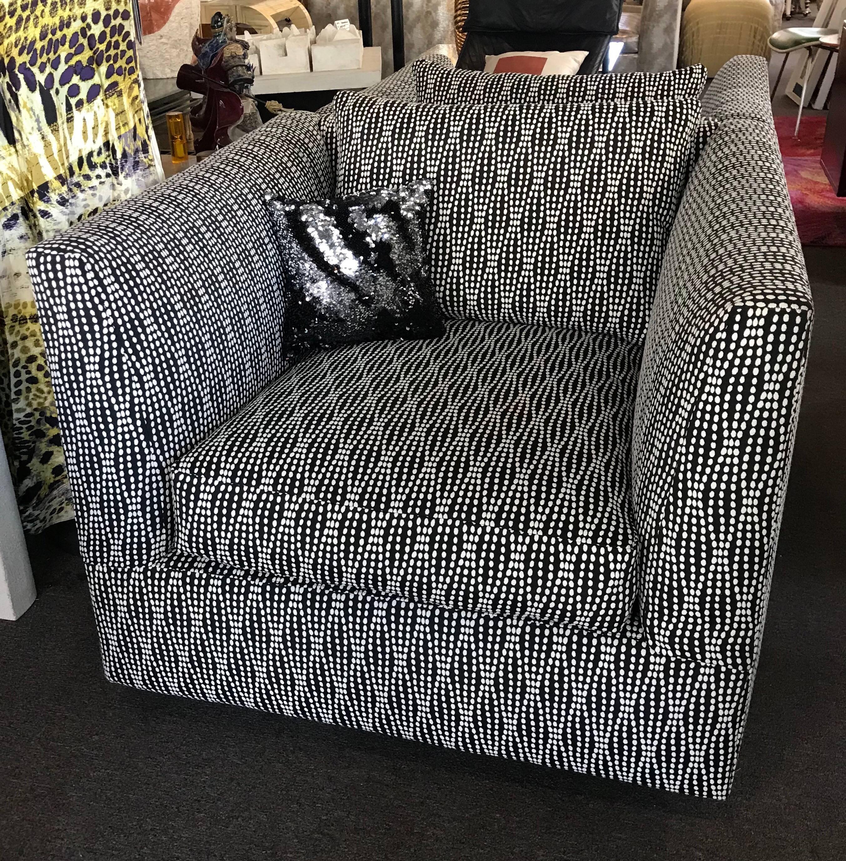 The size and shape of these vintage club chairs is very cool and are very sexy! They have been newly reupholstered in a modern art style black and white jacquard fabric. Loose back cushion and reversible loose seat. Modern and very modern chic!