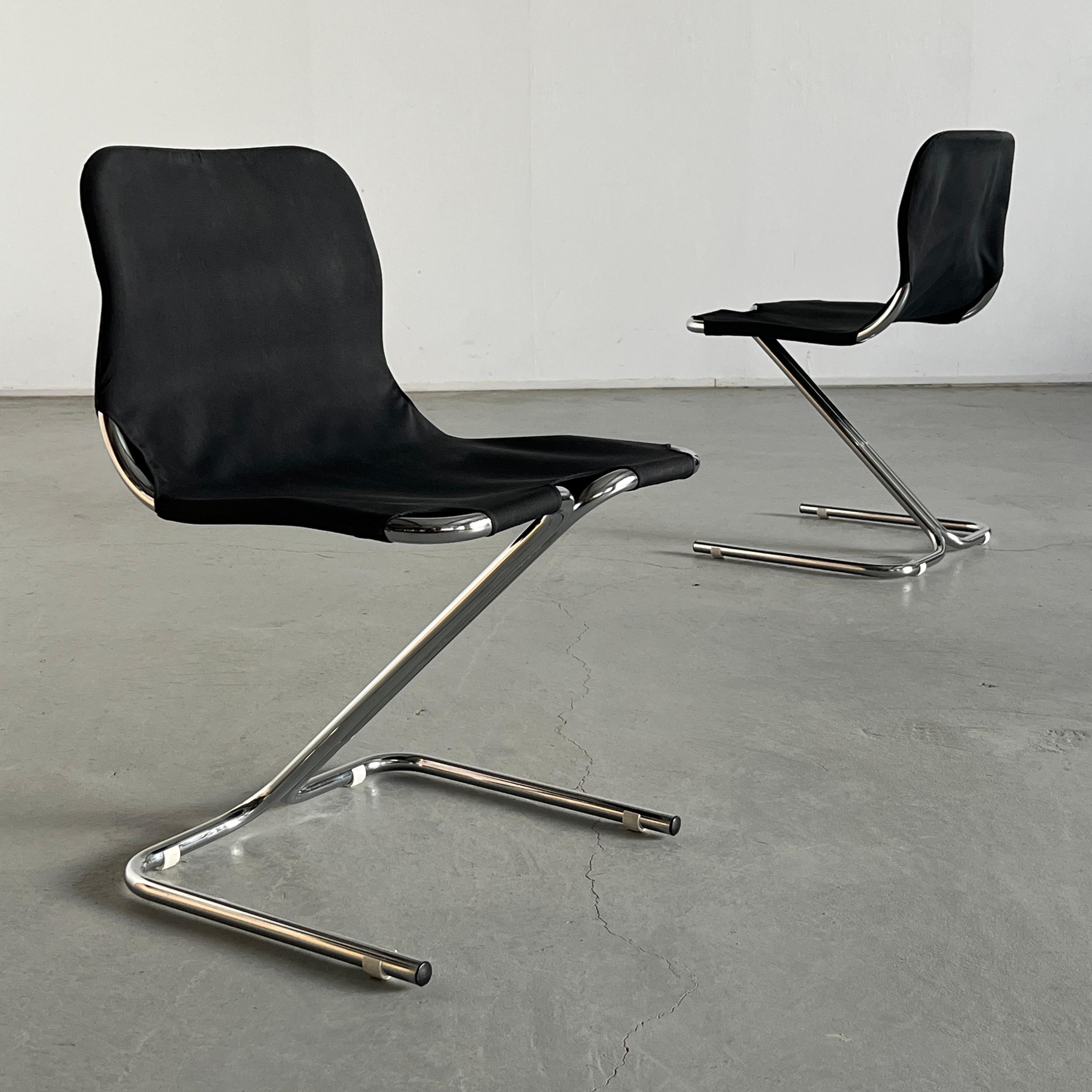 Pair of vintage cantilever dining chairs featuring chromed tubular steel frames and waxed canvas upholstery. Part of the ‘Formula’ series designed by Ruud Ekstrand and Christer Norman for Dux in 1968.
Produced in Sweden, likely in the 1970s.

The