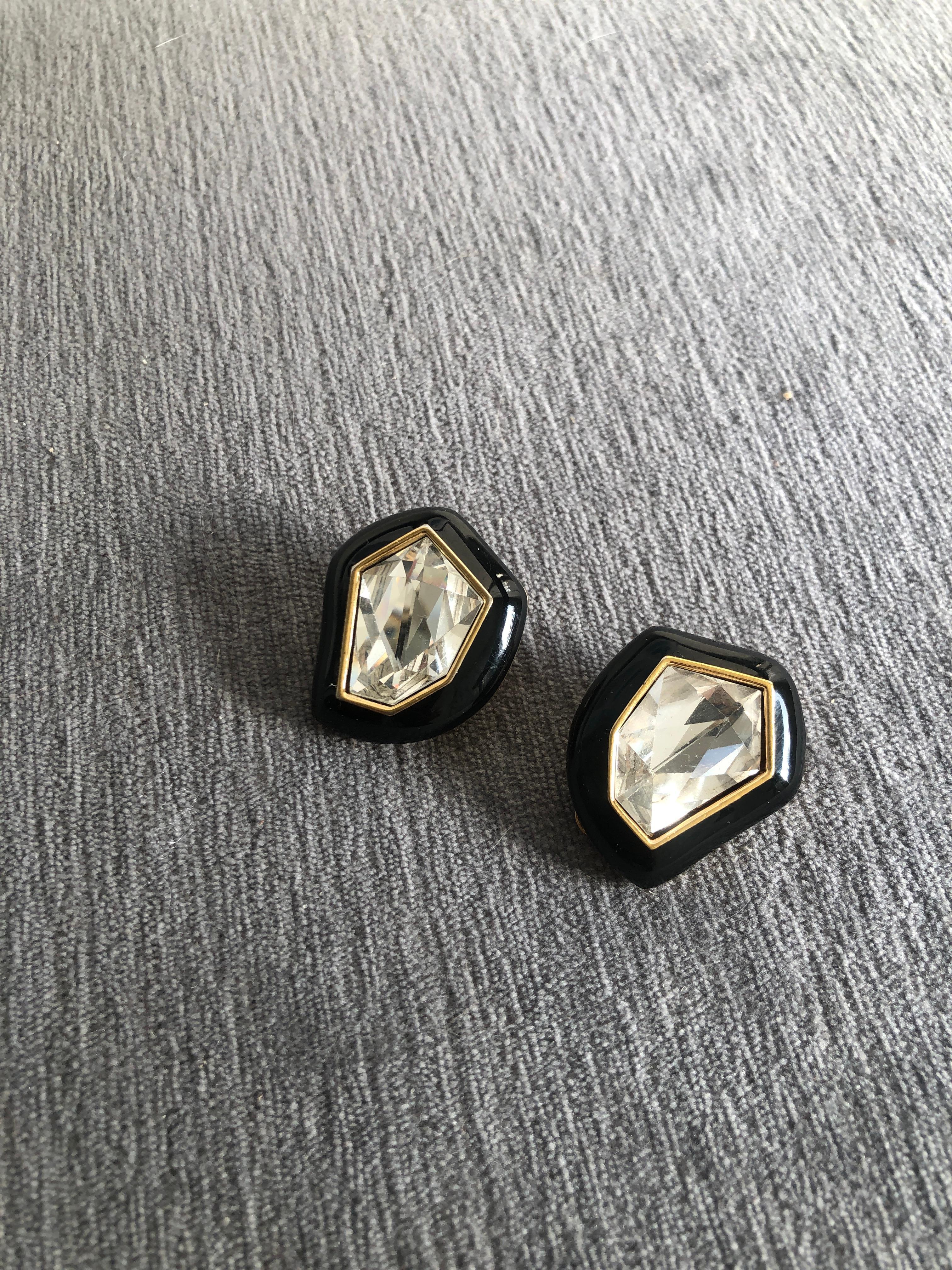 So chic. Designed by Daniel Swarovski in the late 80's. From a very very chic and wealthy Palm Springs Fashionista's estate. Large faceted christals framed in black enamel with gold plate trim. They don't make them like this anymore. They look