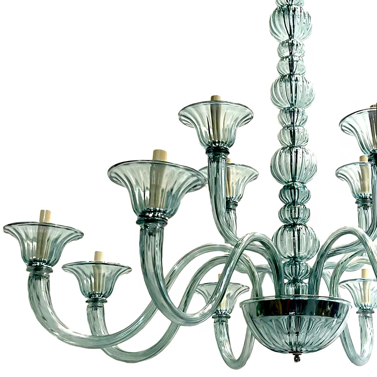 A pair of circa 1960s Italian blown glass chandeliers with 12 lights each. Sold Individually.

Measurements:
Diameter:45”
Current drop: 38” (adjustable).