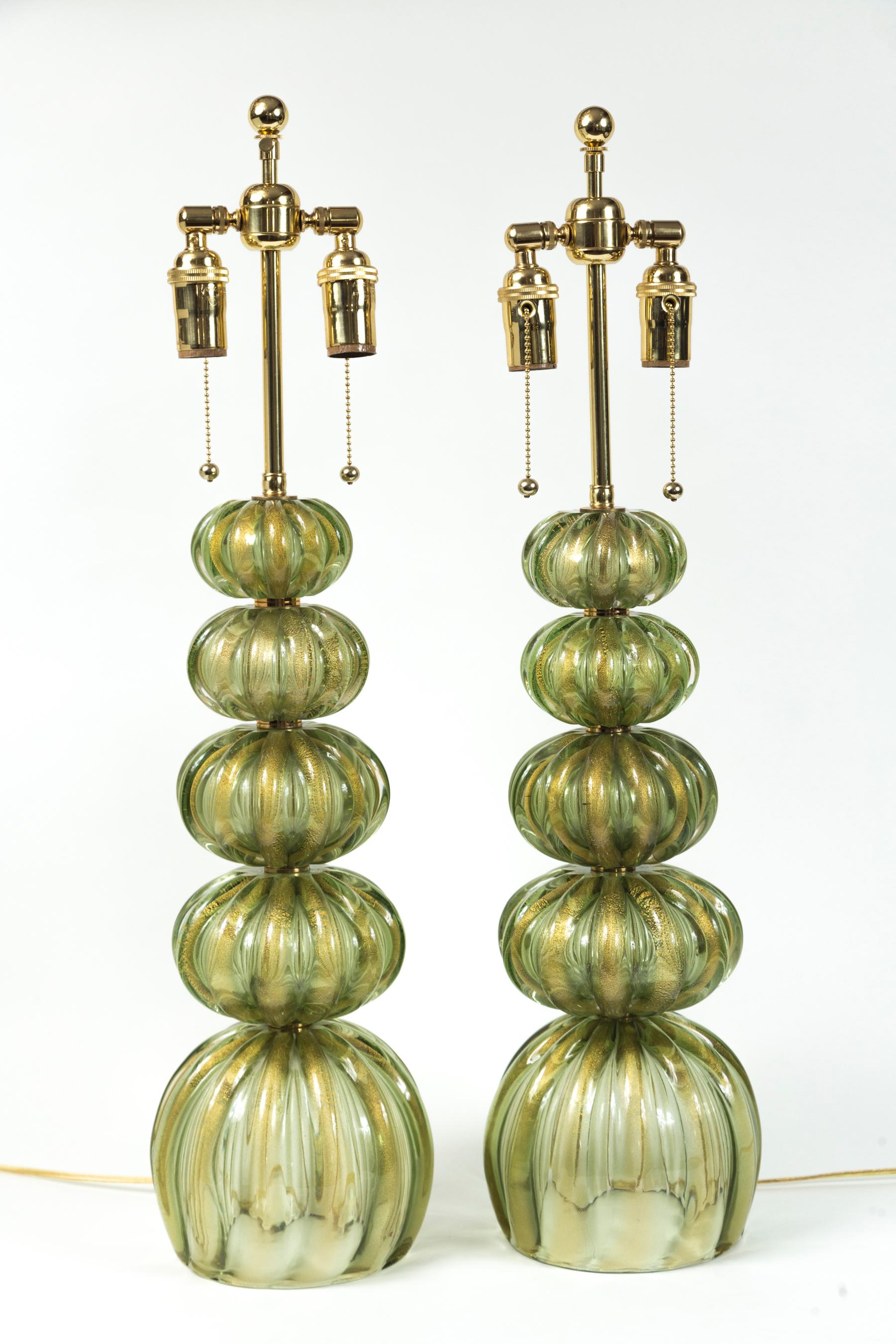 Stunning pair of gold blown green table lamps by Pauly & C

Origin: Murano, Italy

Glass Dating: 1978-1980ca , lamping reconfigured and lamping in polished brass

Dimensions: Glass 8? diameter

Lamp height to the top of the glass 19?

Lamp