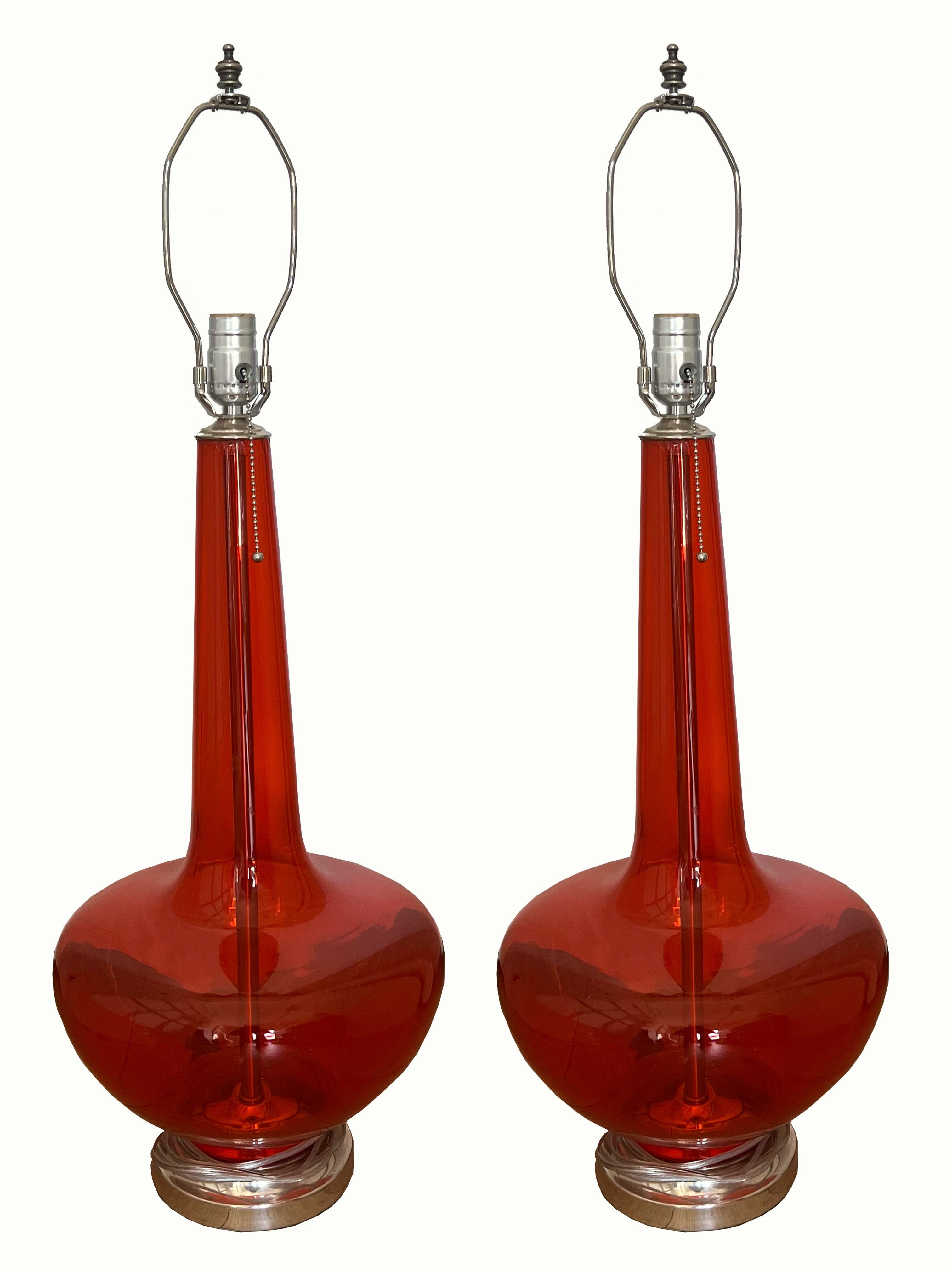 This is a pair of vintage Murano lamps. The glass is in perfect condition and the brass is in excellent condition. They are sold as a pair. The dimensions of the amps are 31