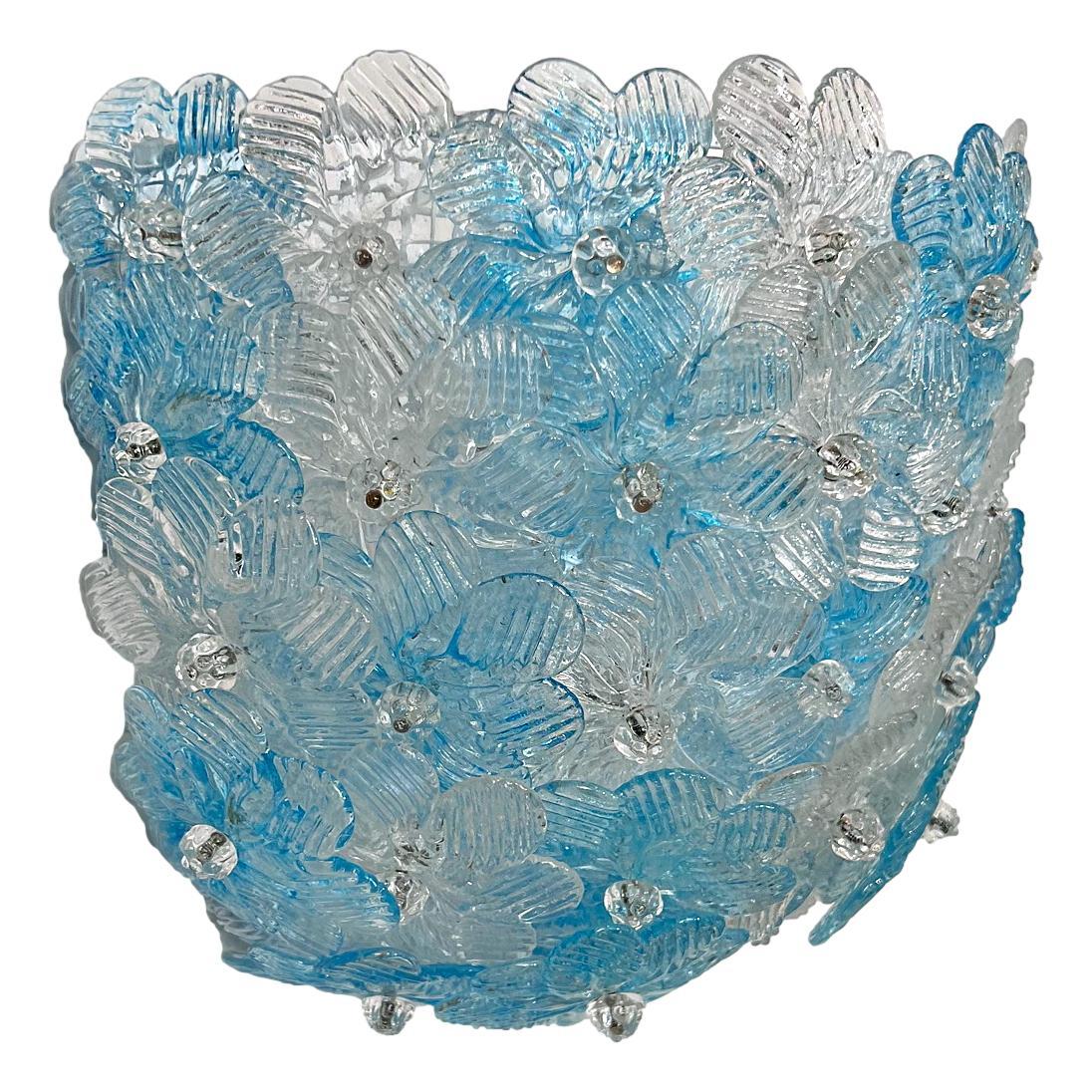 A pair of circa 1960's Murano sconces with blue and clear flowers.

Measurements:
Width: 11