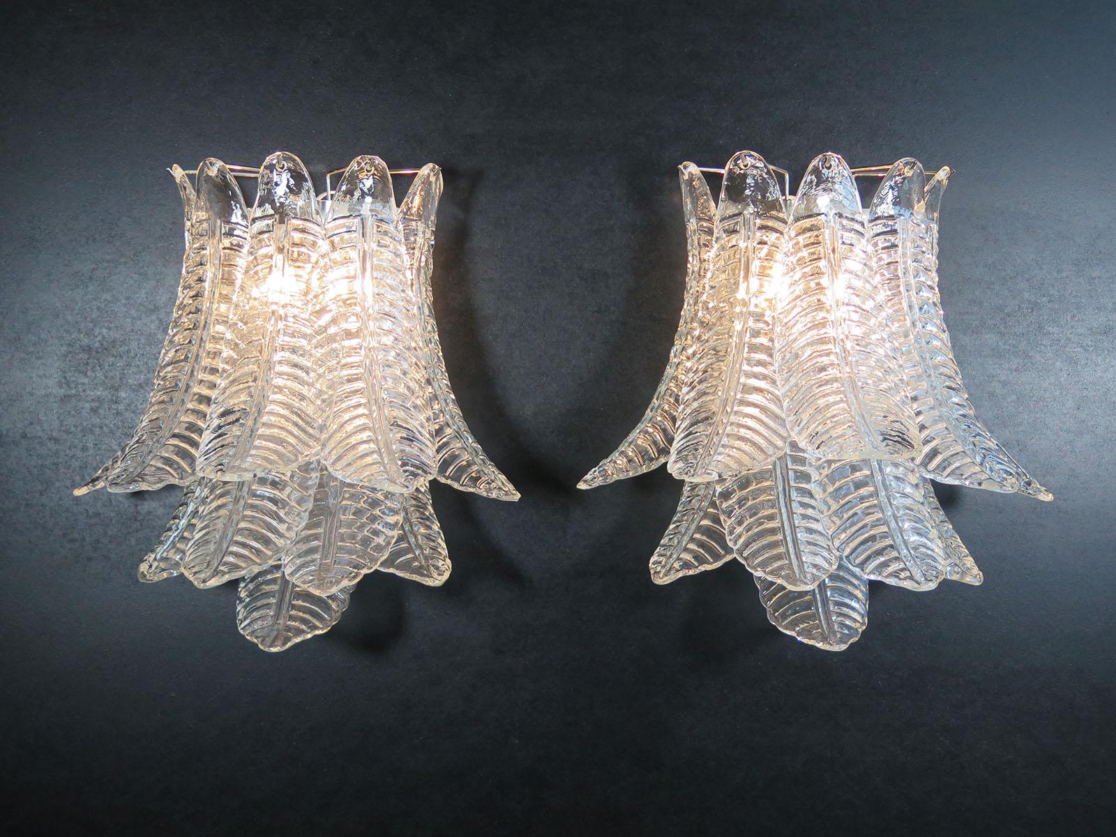 Fantastic pair of vintage Murano wall sconces made by 10 Murano trasparent Six-Tier Felci for each applique in a chrome metal frame.
Period: late XX century
Dimensions: 18,50 inches height (47 cm); 18,50 inches width (47 cm); 13 inches depth from
