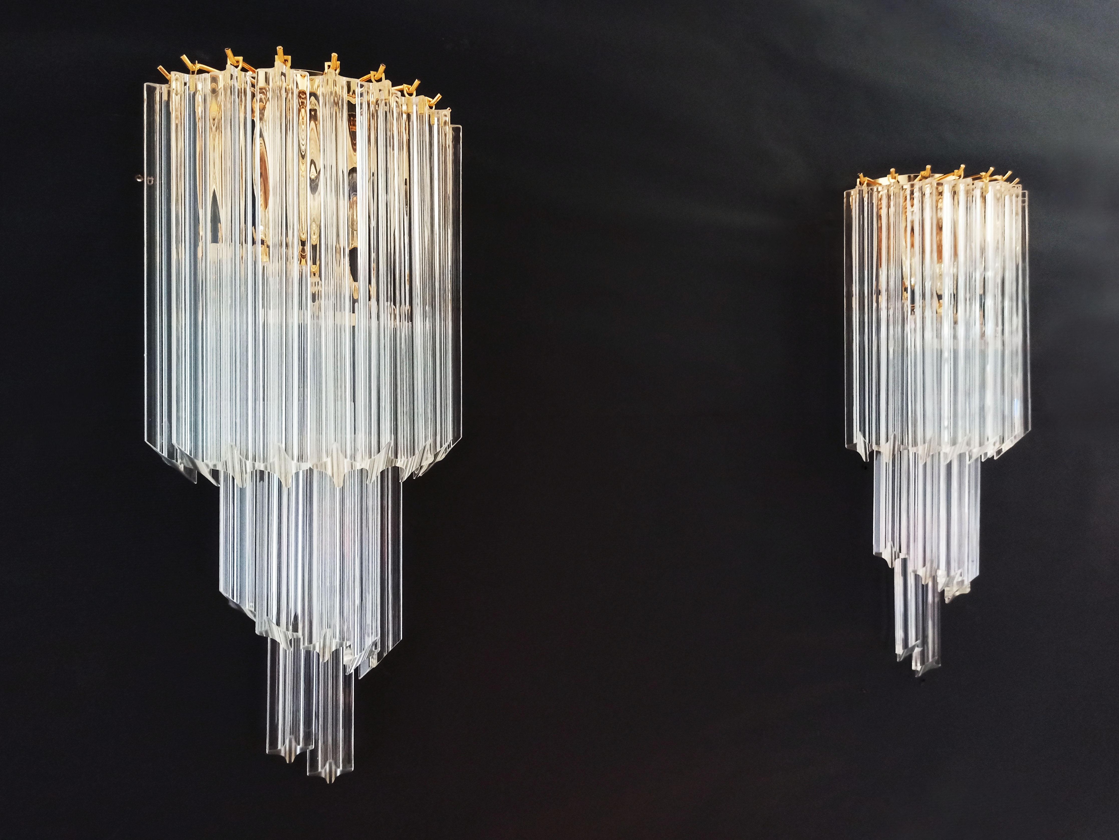 Fantastic pair of vintage Murano wall sconce made by 16 transparent Murano crystal prism (quadriedri) for each applique in a gold metal frame. The shape of this sconce is spiral.
Period: late 20th century
Dimensions: 21.65 inches height (55 cm),