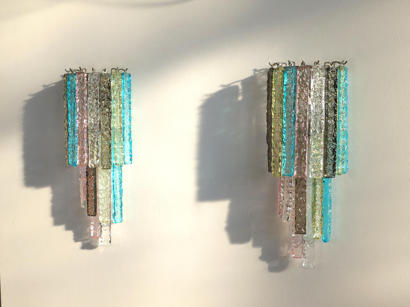 Fantastic pair of vintage Murano wall sconce made by 16 multi-color Murano crystal prism icicle for each applique in a chrome metal frame. The shape of this sconce is spiral.
Period: Late 20th century
Dimensions: 21.65 inches height (55 cm), 9.85