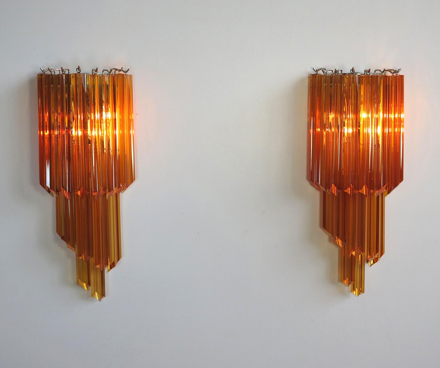 Fantastic pair of vintage Murano wall sconce made by 16 Murano crystal prism (quadriedri) for each applique in a chrome metal frame. The shape of this sconce is spiral.
Period: late 20th century
Dimensions: 21.65 inches height (55 cm); 9.85 inches