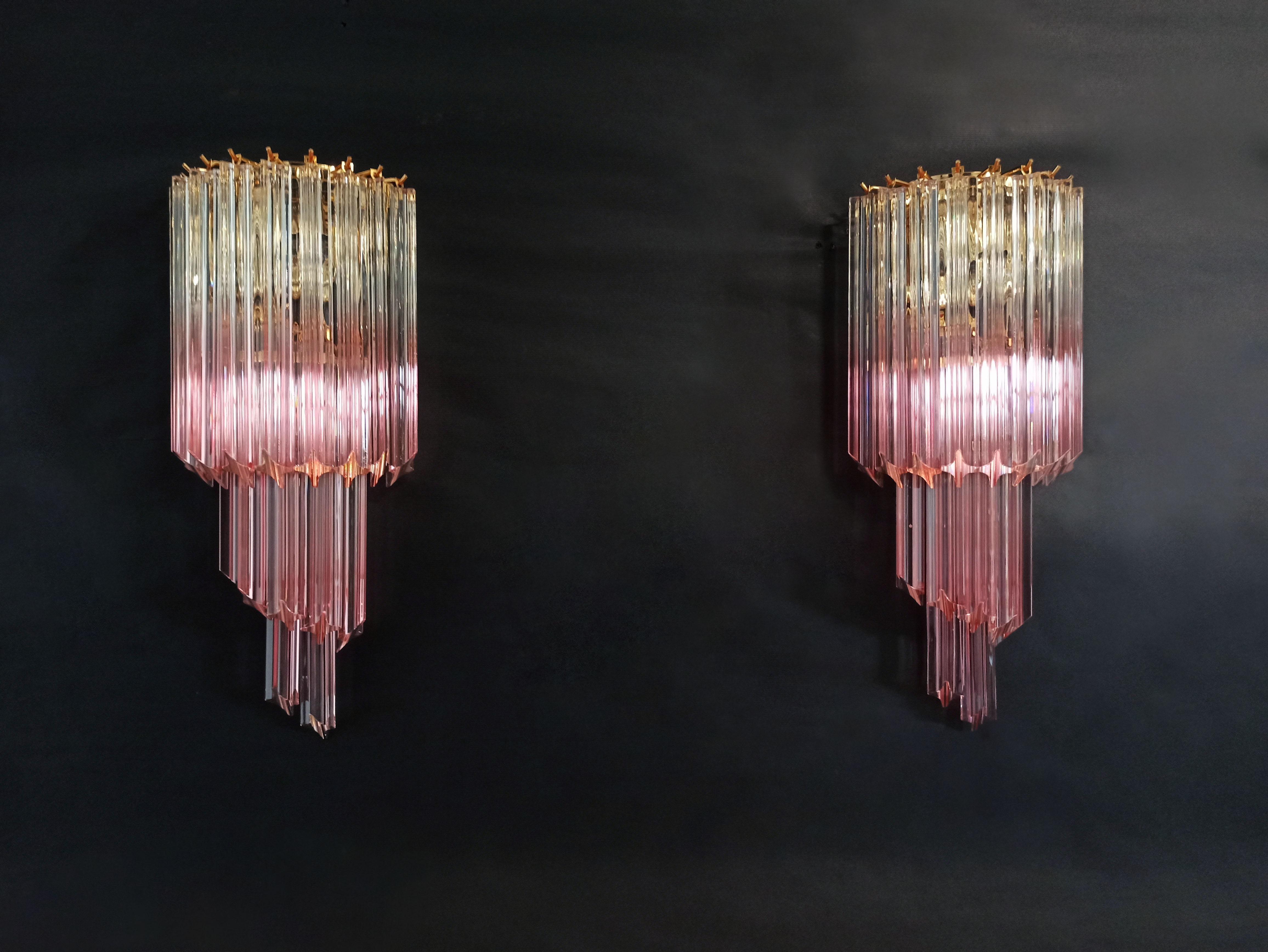 Fantastic pair of vintage Murano wall sconce made by 16 Murano crystal prism (quadriedri) for each applique in a gold metal frame. The shape of this sconce is spiral. The glasses have a particular color, transparent with pink shades.
Period: late