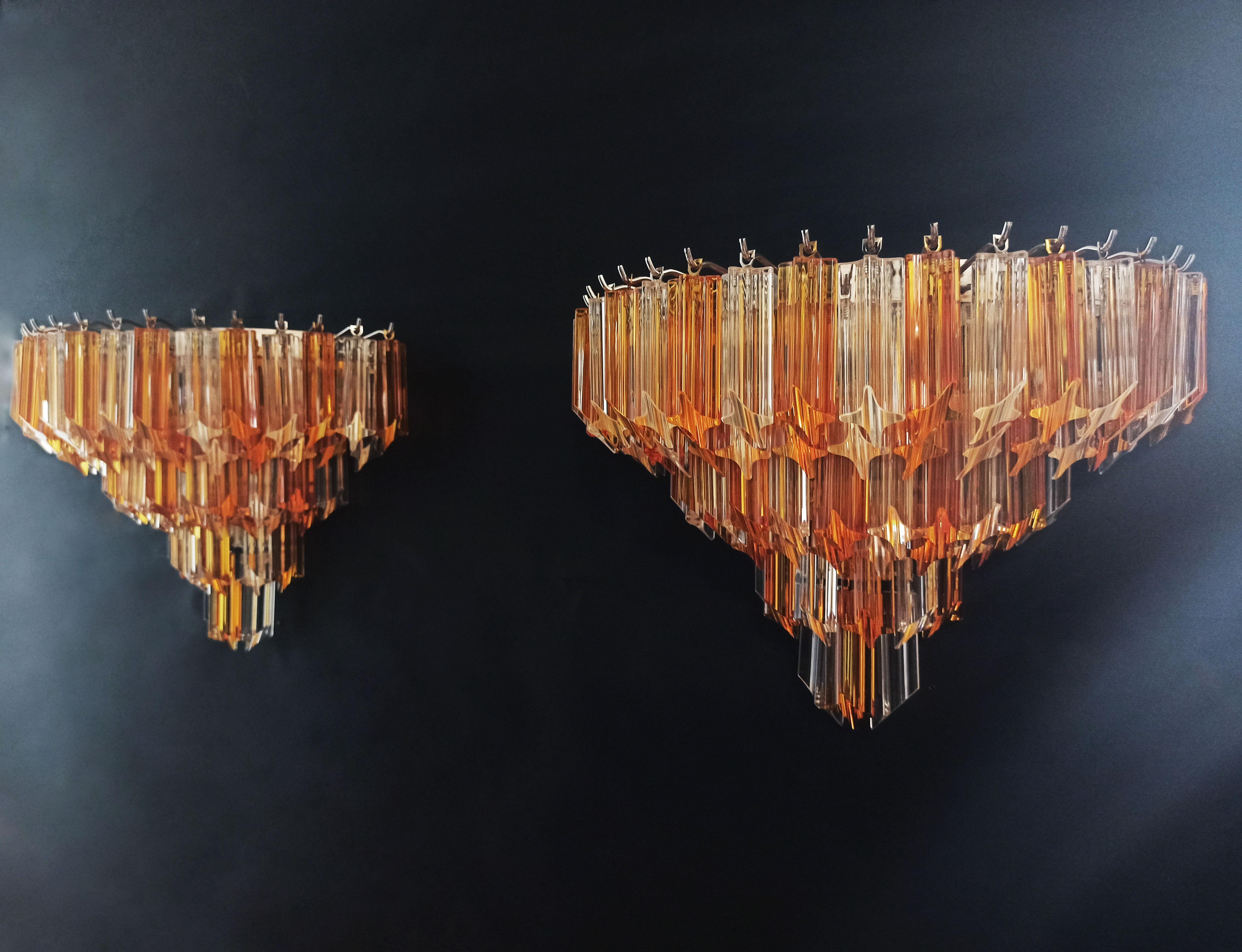 Fantastic pair of vintage Murano wall sconce made by 63 Murano crystal prism (quadriedri) for each applique in a chrome metal frame. The glasses are trasparent and amber.
Period: 1980s
Dimensions: 13.60 inches height (35 cm); 16.60 inches width