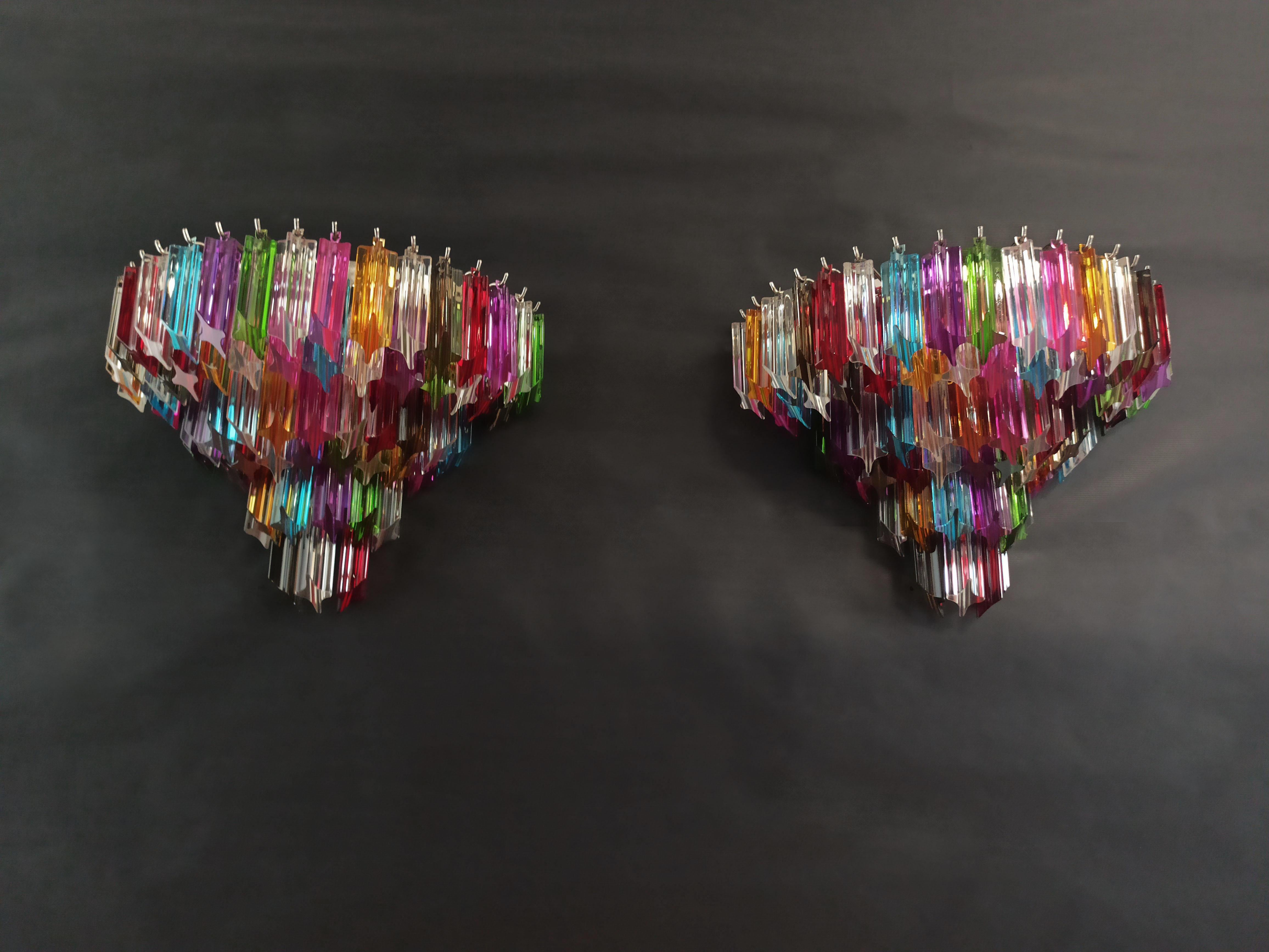 Fantastic pair of vintage Murano wall sconce made by 63 Murano multicolred crystal prism (quadriedri) for each applique
in a chrome metal frame.
Period: 1980s
Dimensions: 13,60 inches height (35 cm); 16,60 inches width (43 cm); 8,15 inches depth