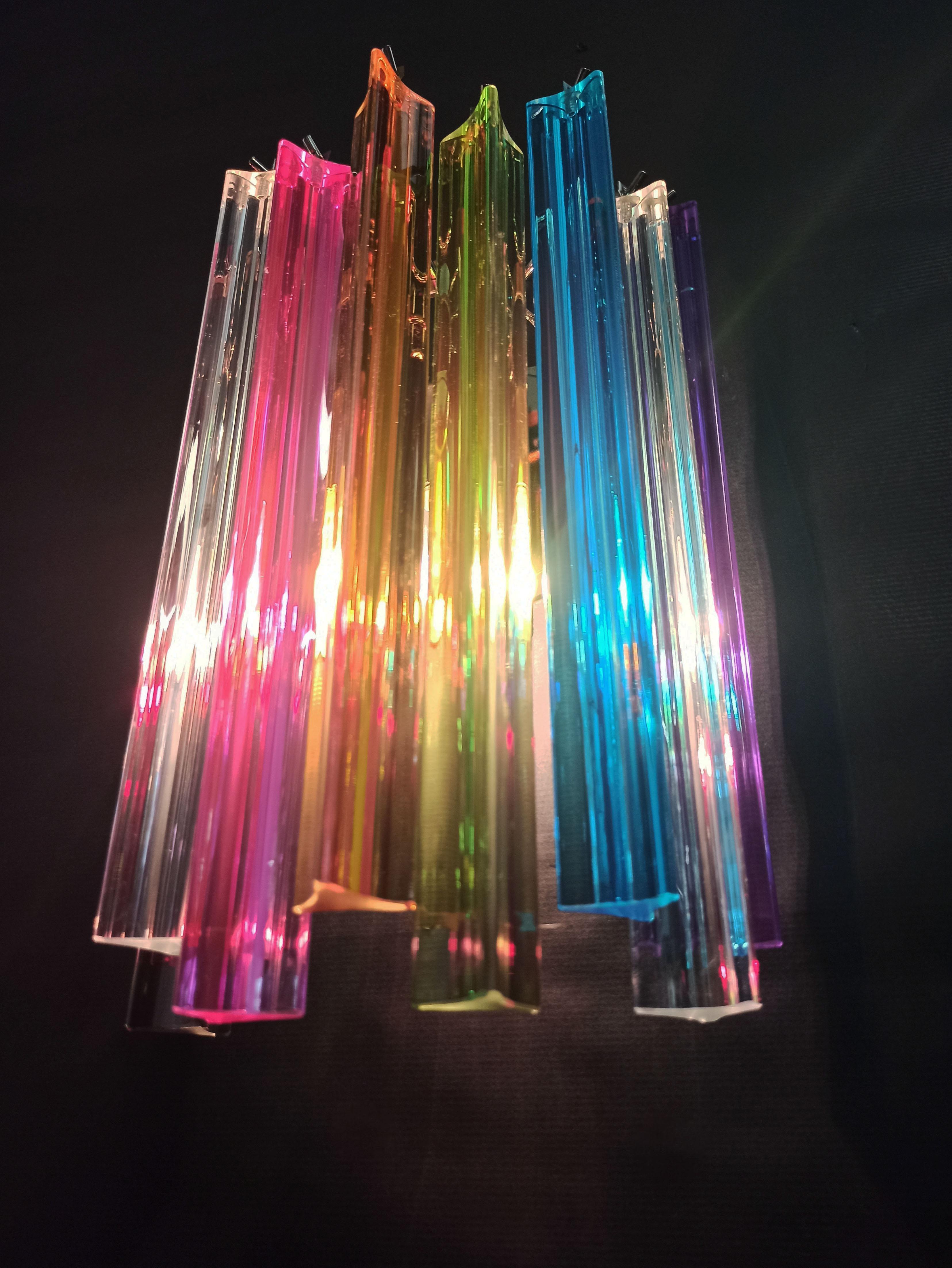Fantastic pair of vintage Murano wall sconce made by 9 Murano multicolored crystal prism (triedri) for each applique in a nickel plated metal frame.
Period: Late 20th century
Dimensions: 12.40 inches height (32 cm), 7.8 inches width (20 cm), 5