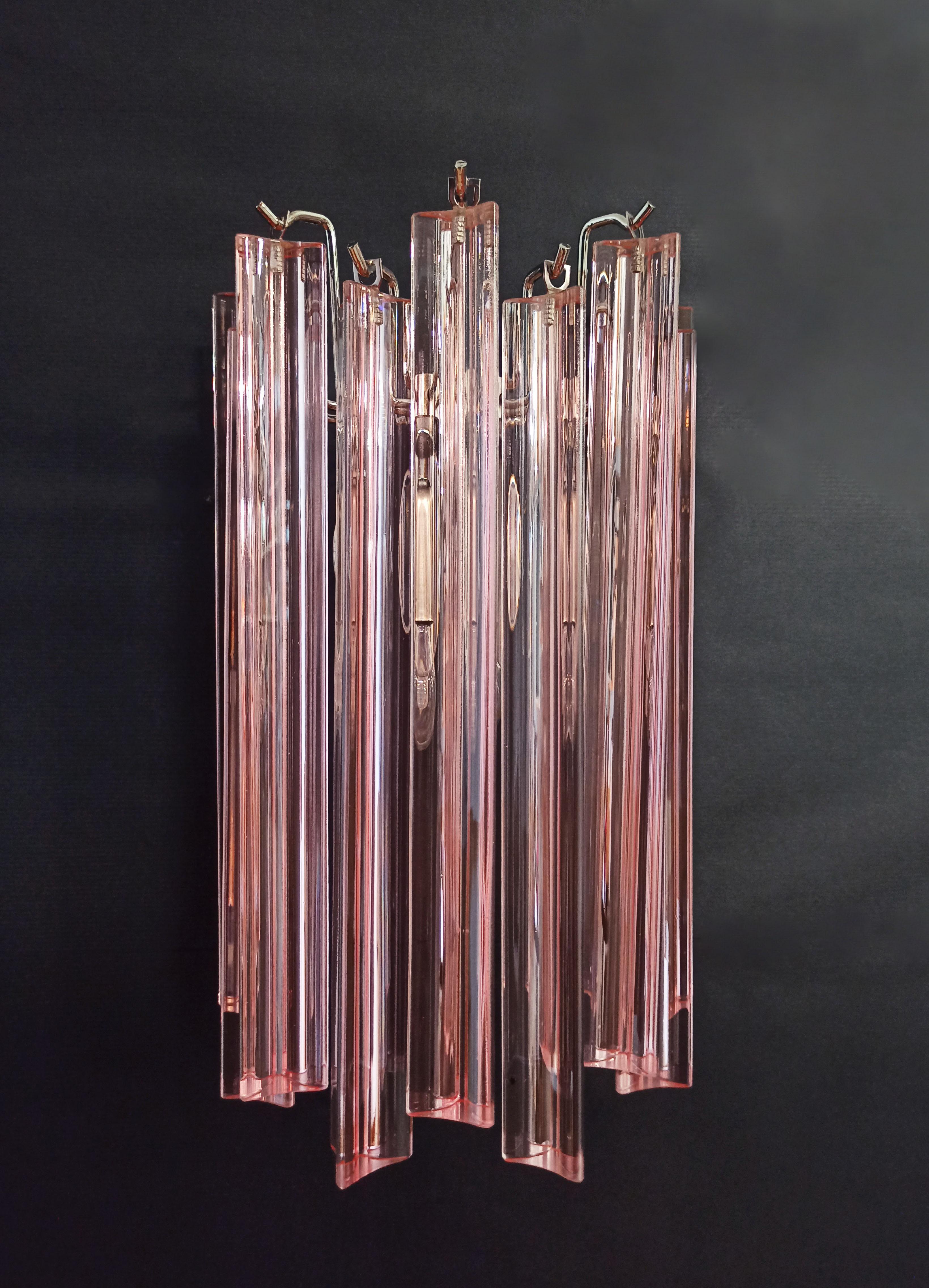 Fantastic pair of vintage Murano wall sconce made by 9 Murano pink crystal prism (triedri) for each applique  in a chrome metal frame.
Period: late XX century
Dimensions: 12,40 inches height (32 cm); 7,8 inches width (20 cm); 5 inches depth from the