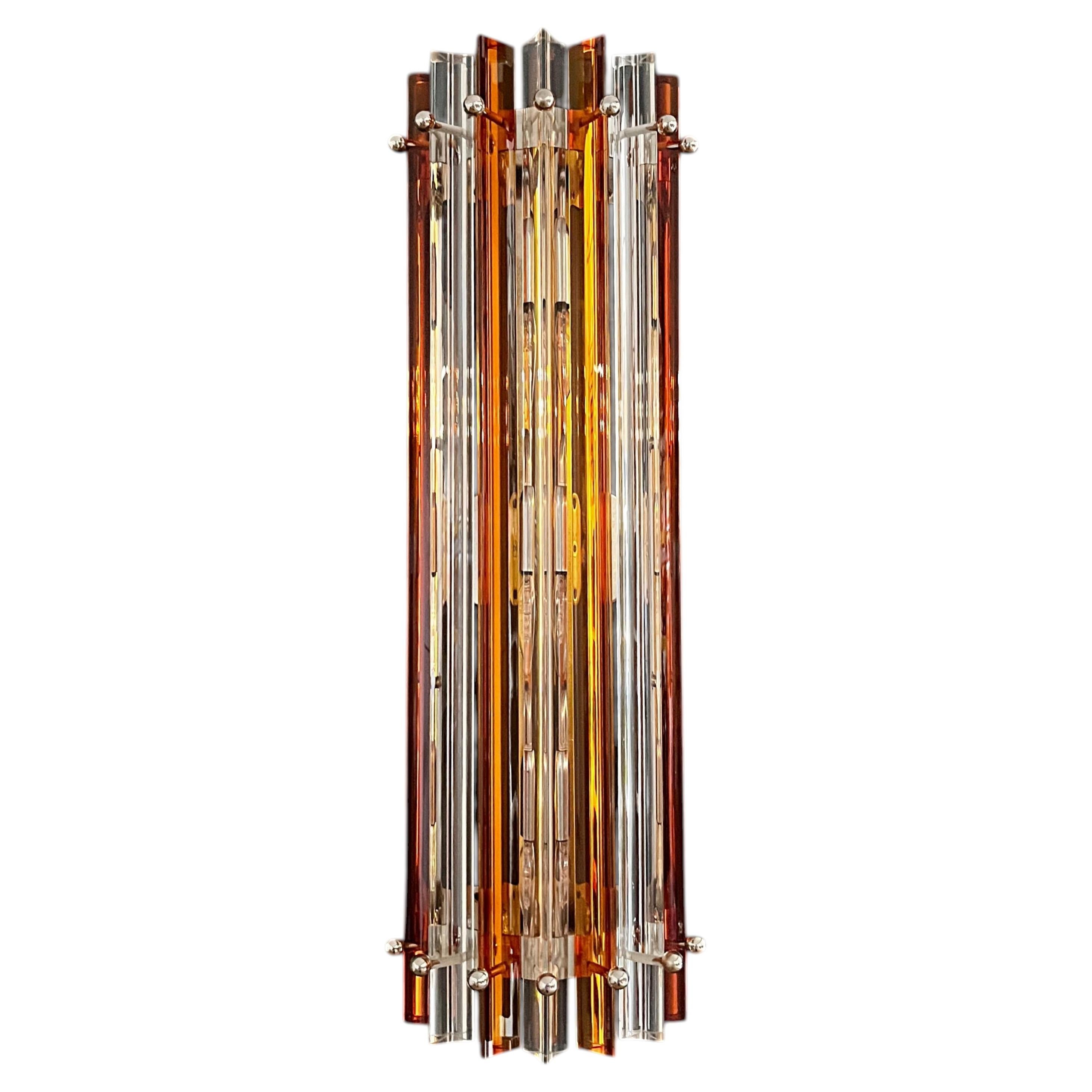 Pair of vintage Murano wall sconces—clear and amber triedri—Column model For Sale