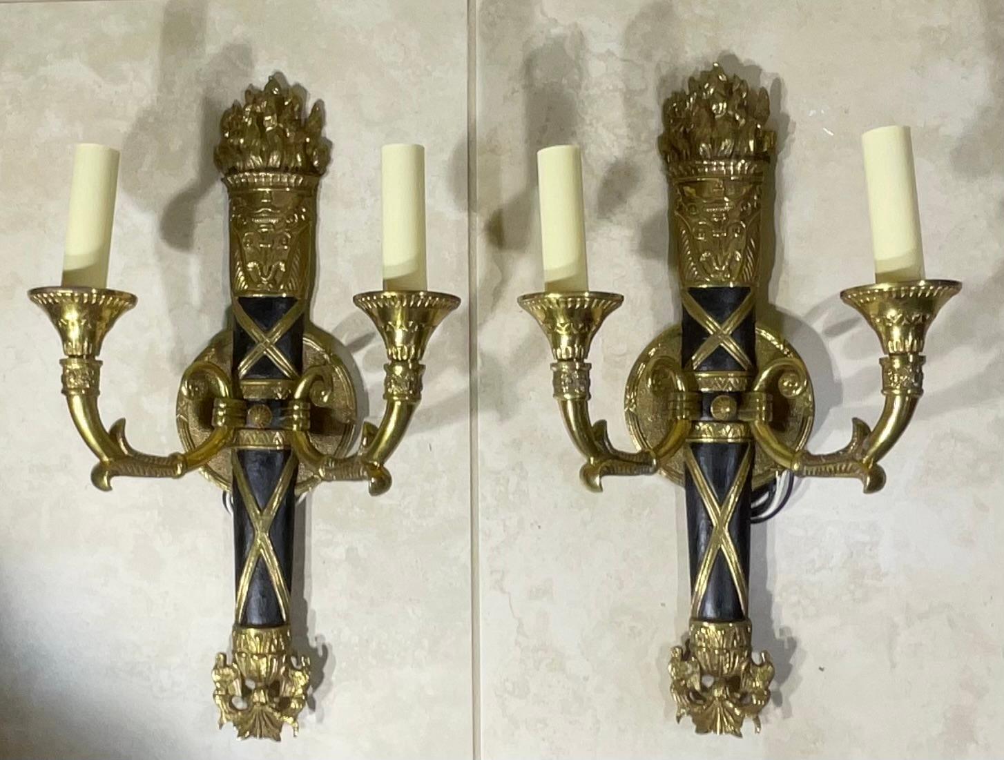 Elevate your home's ambiance with this truly elegant pair of vintage sconces, crafted with meticulous details, These impressive fixtures are more than just lighting; they are a testament to classic design and enduring craftsmanship, sure to become a