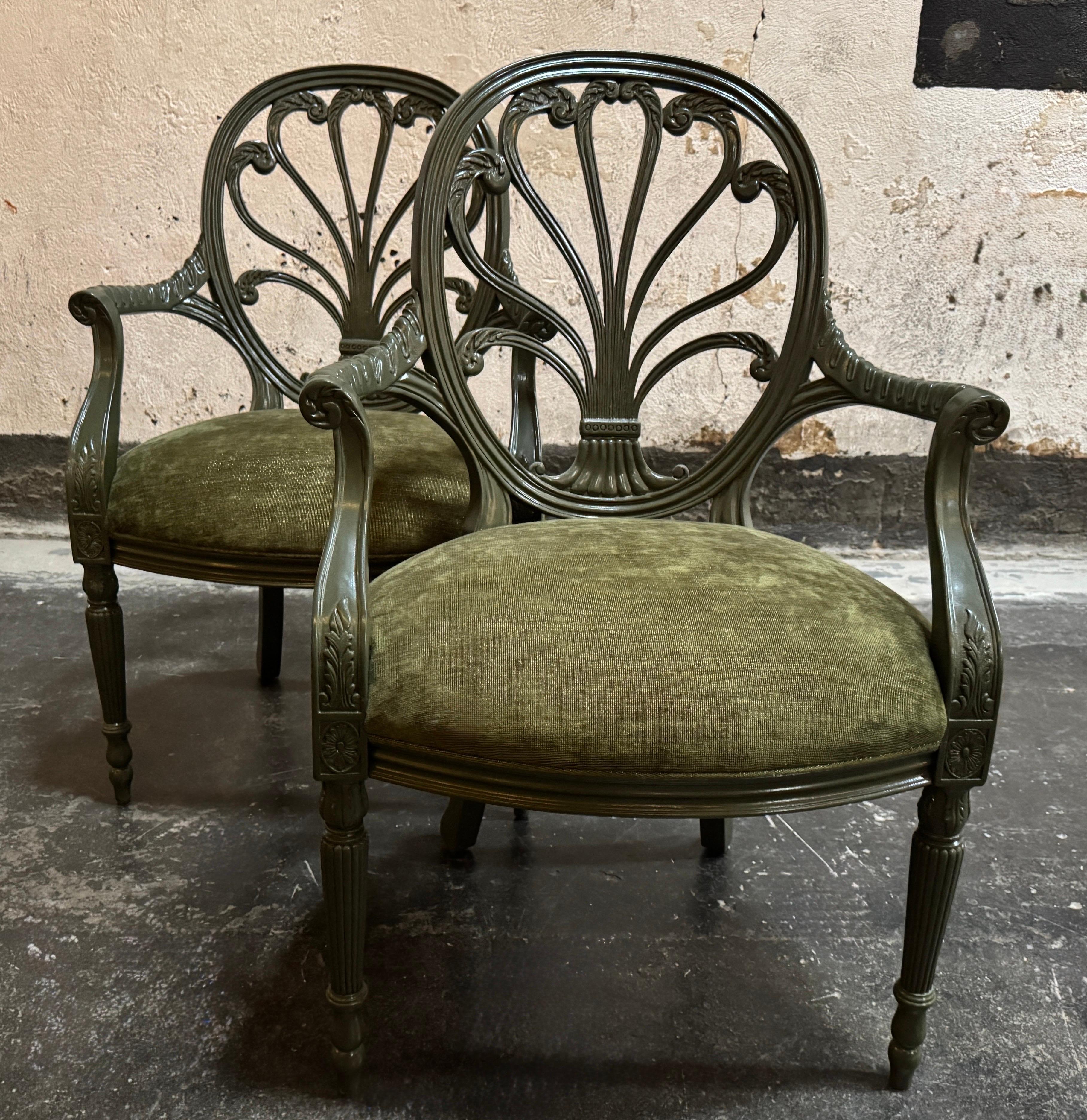 Handsome recent vintage pair of chairs crafted in the English Neoclassical Revival style, specifically referencing the delicate designs of Sheraton and Hepplewhite from the late 18th century, but believed to have been originally made in the 1990s.