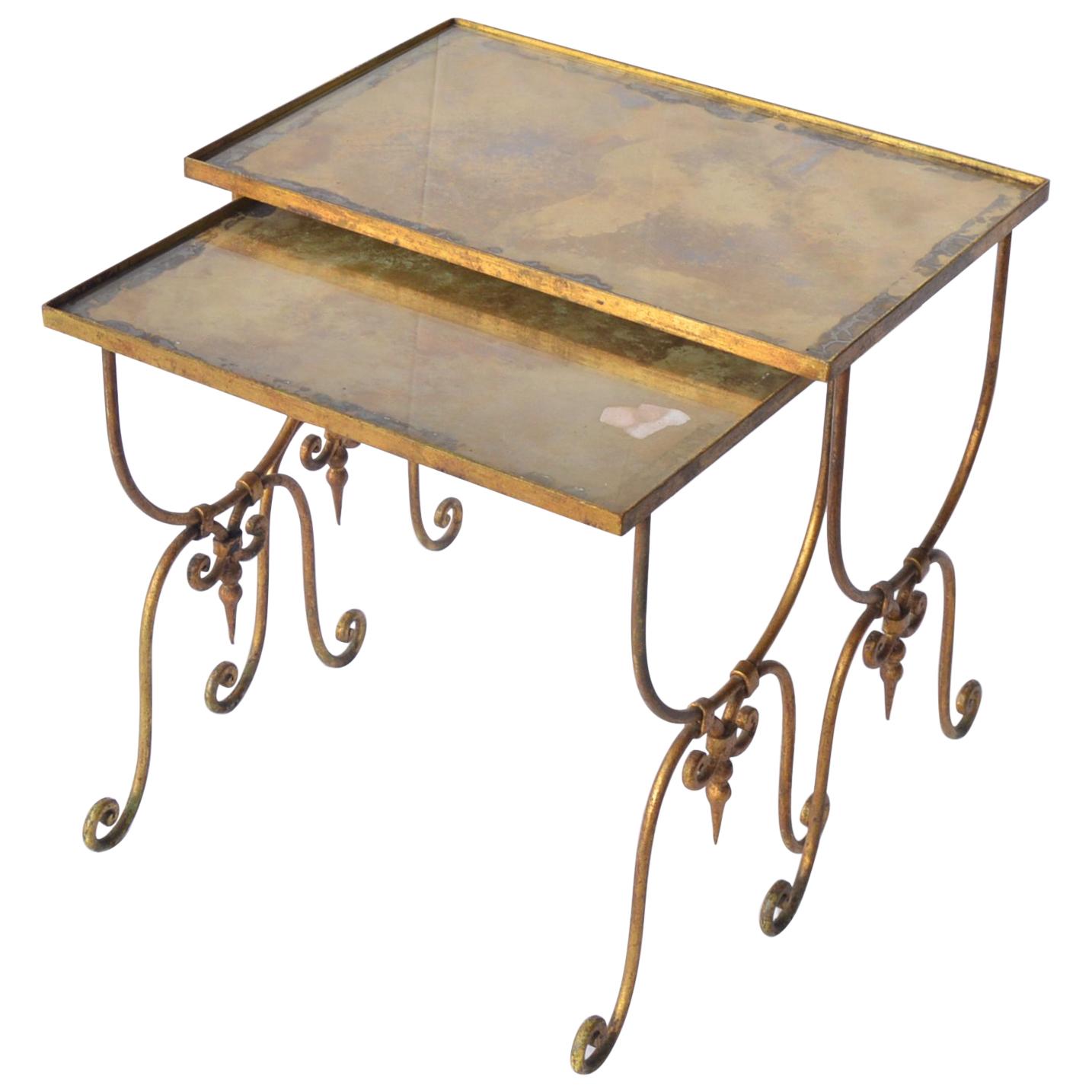 Pair of Vintage Nesting Metal Mounted Tables with Oxidized Glass Top For Sale