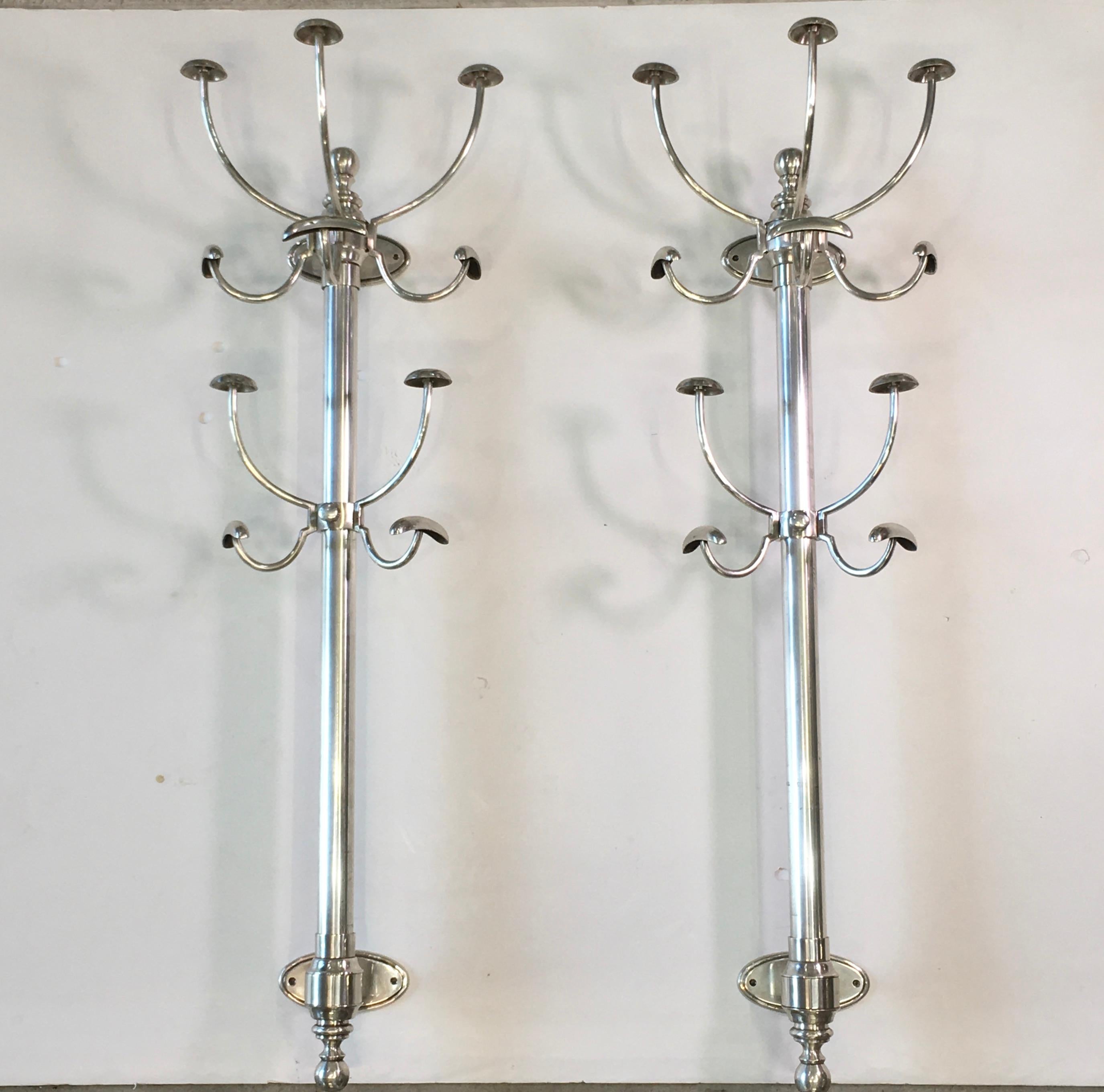 Pair of bracket mounted coat & hat trees made of nickel plated brass. These are high quality and heavy duty, like what you would have found in an old world gentleman's club. The lower set of hooks is height adjustable and simply slides up or down