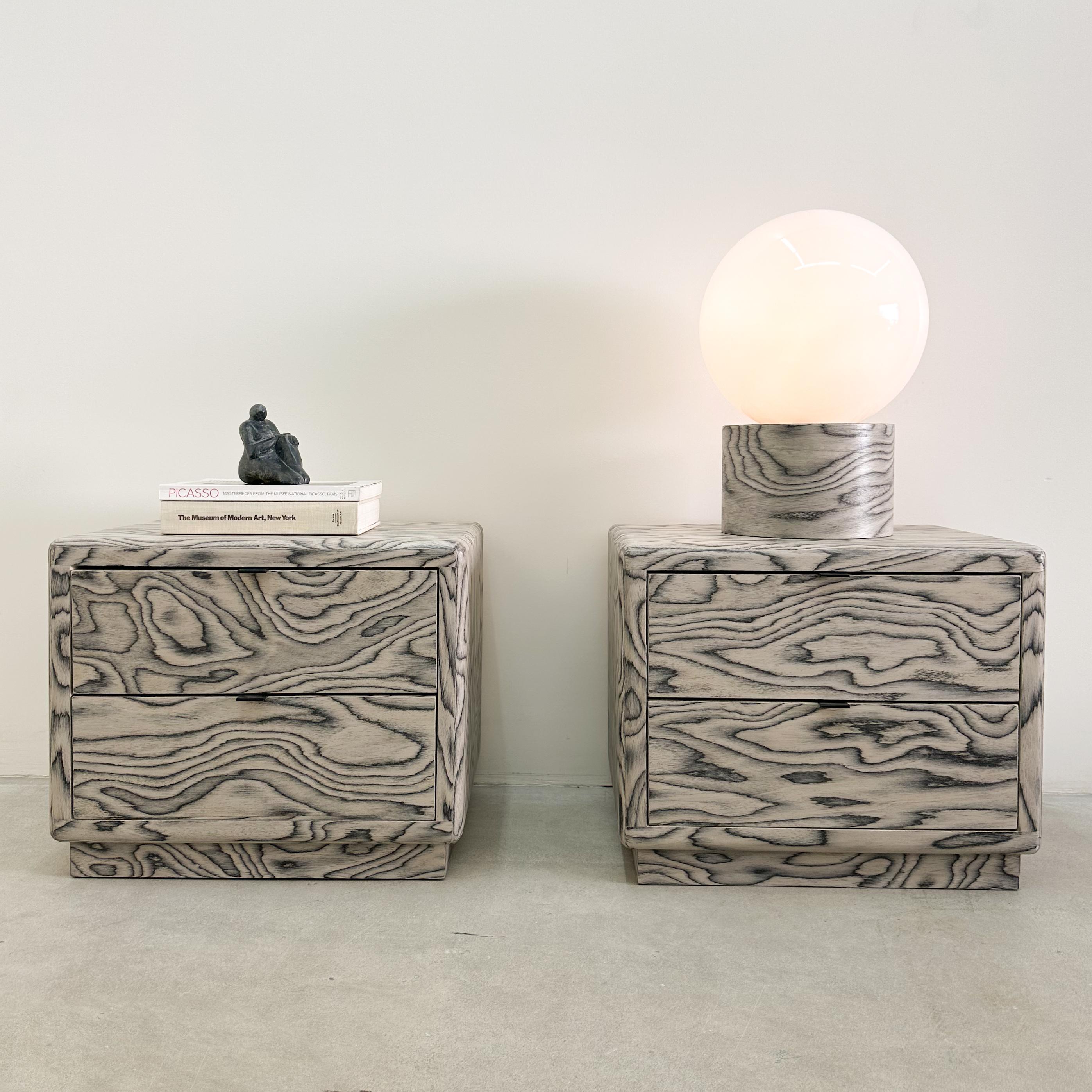 The vintage nightstands have been re-veneered in an Ettore Sottsass pattern from 1985. ALPI manufactures the distinctive veneer. It has been sealed with a satin finish for added durability. The pulls are black.

Color: Grey &