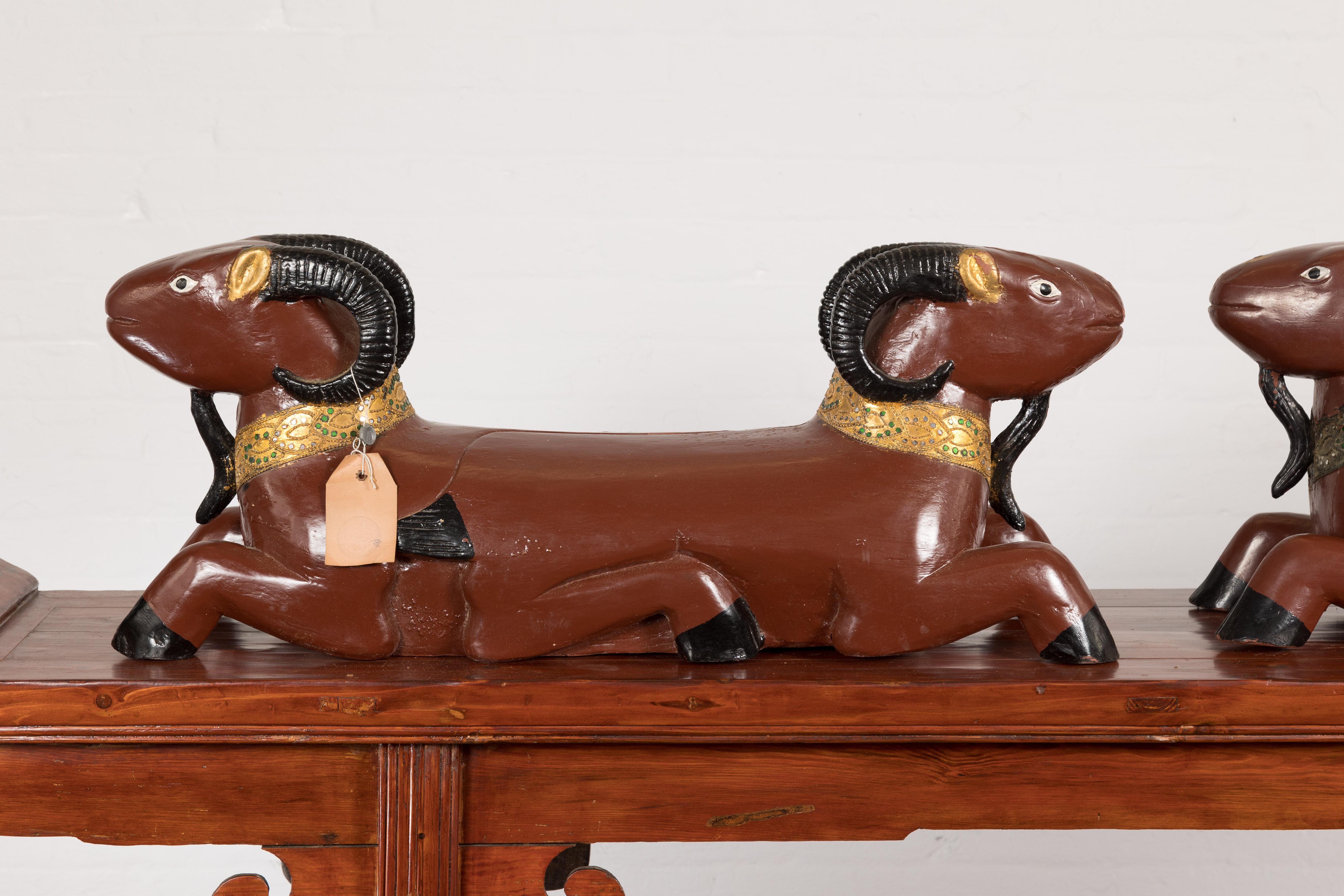 Gilt Pair of Vintage Northern Thai Double Ram Sculptures with Reddish Brown Lacquer For Sale