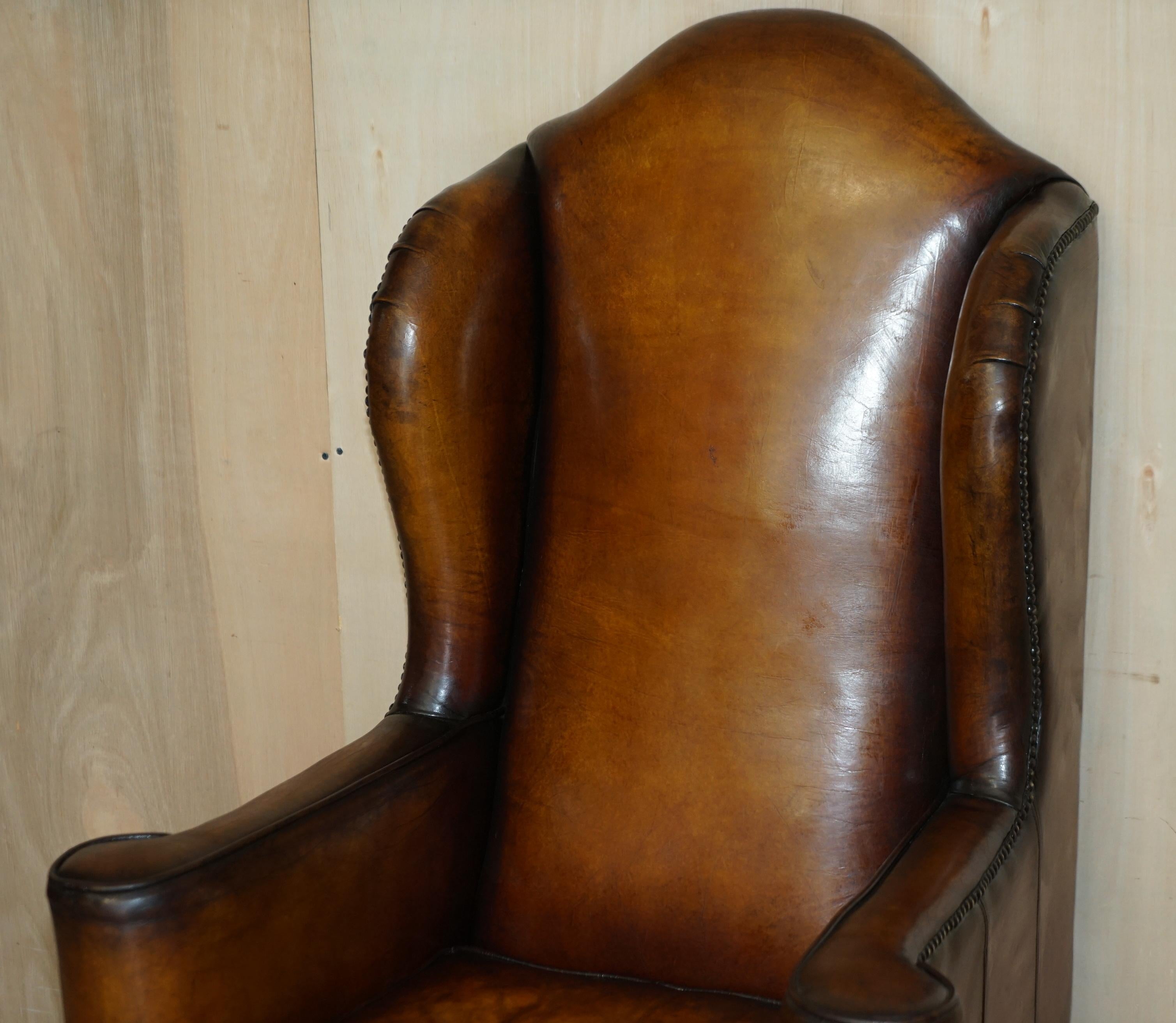English Pair of Vintage Oak Framed William Morris Cigar Brown Leather Wingback Armchairs