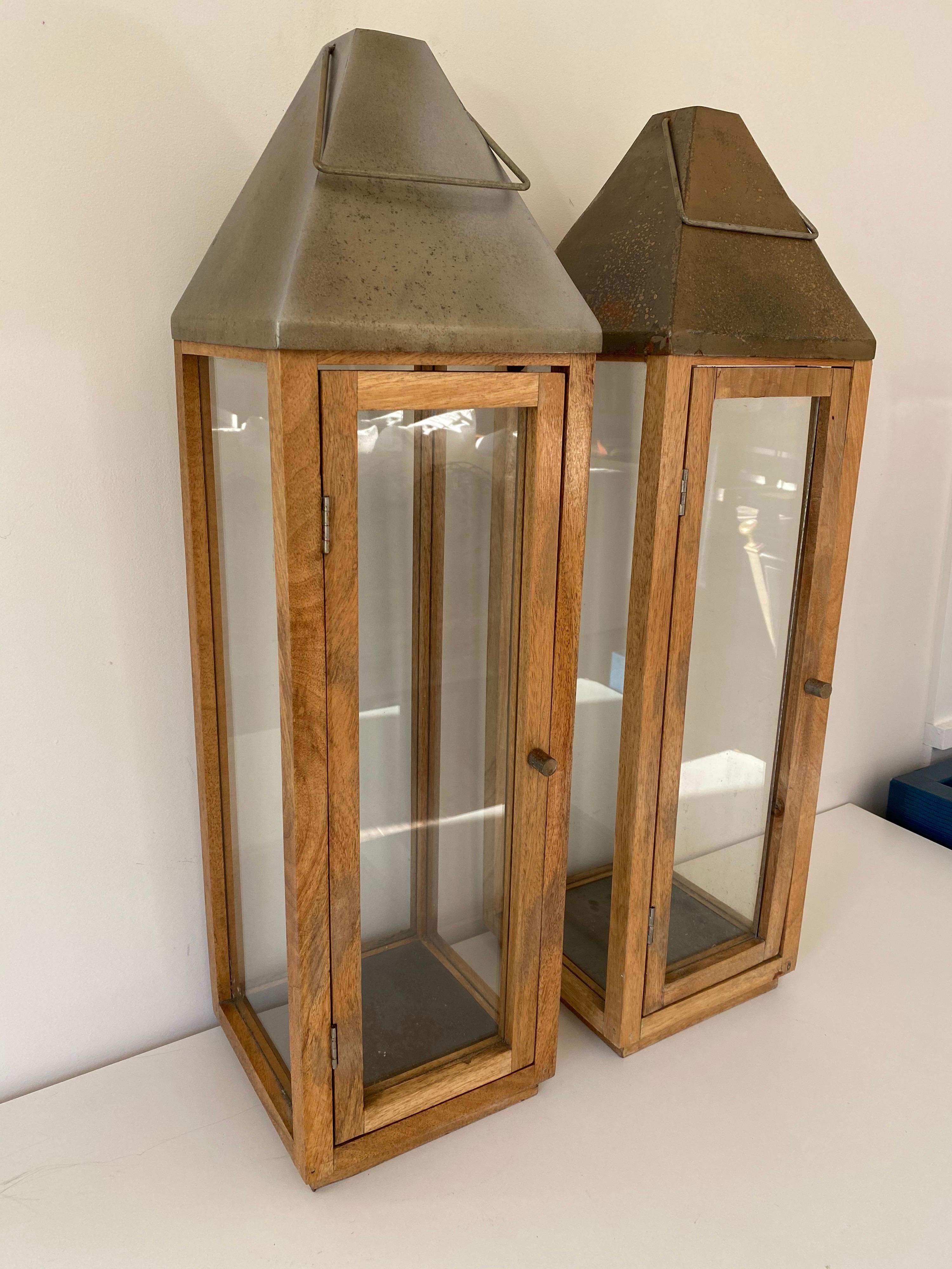 A pair of vintage oak planters with glass panels and steel tops with handles. Great scale and presence.