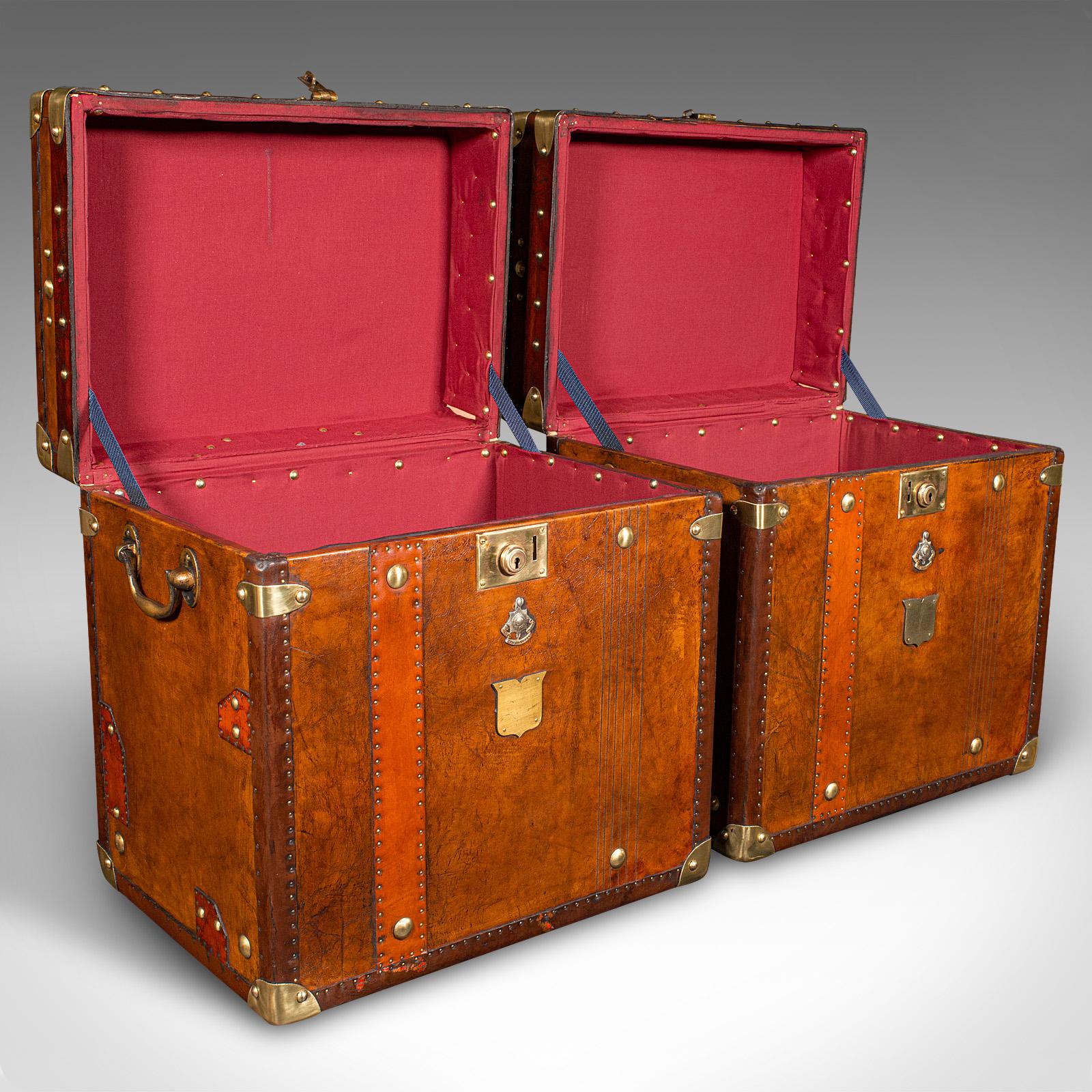 This is a pair of vintage officer's campaign luggage cases. An English, leather and brass bedside nightstand, dating to the late 20th century, circa 1980.

Exquisite casework, with nicely appointed detail and finishes
Displays a desirable aged