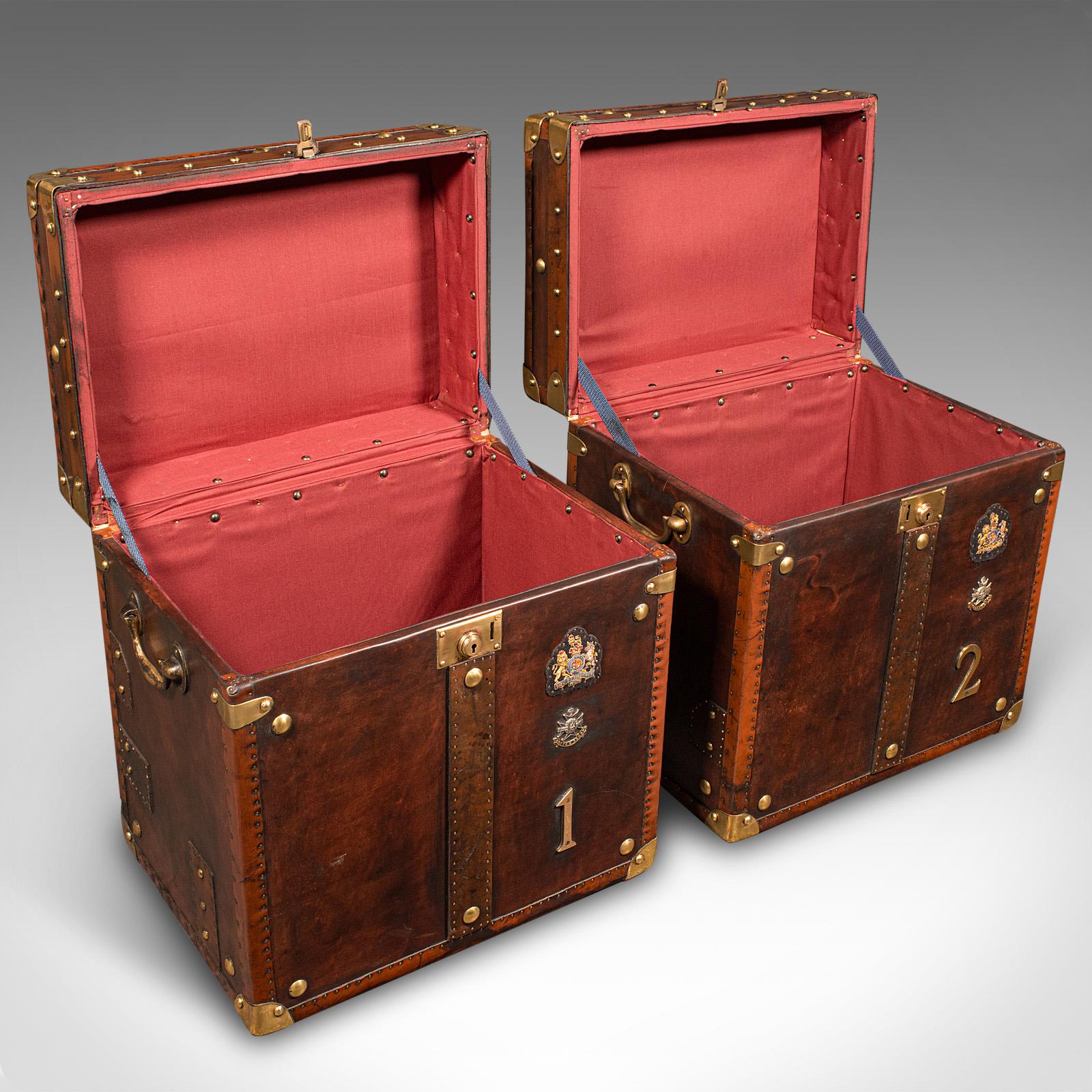 
This is a pair of vintage officer's campaign trunks. An English, leather and brass bedside nightstand, dating to the late 20th century period, circa 1990.

Superb casework, with nicely appointed detail and finishes
Displaying a desirable aged