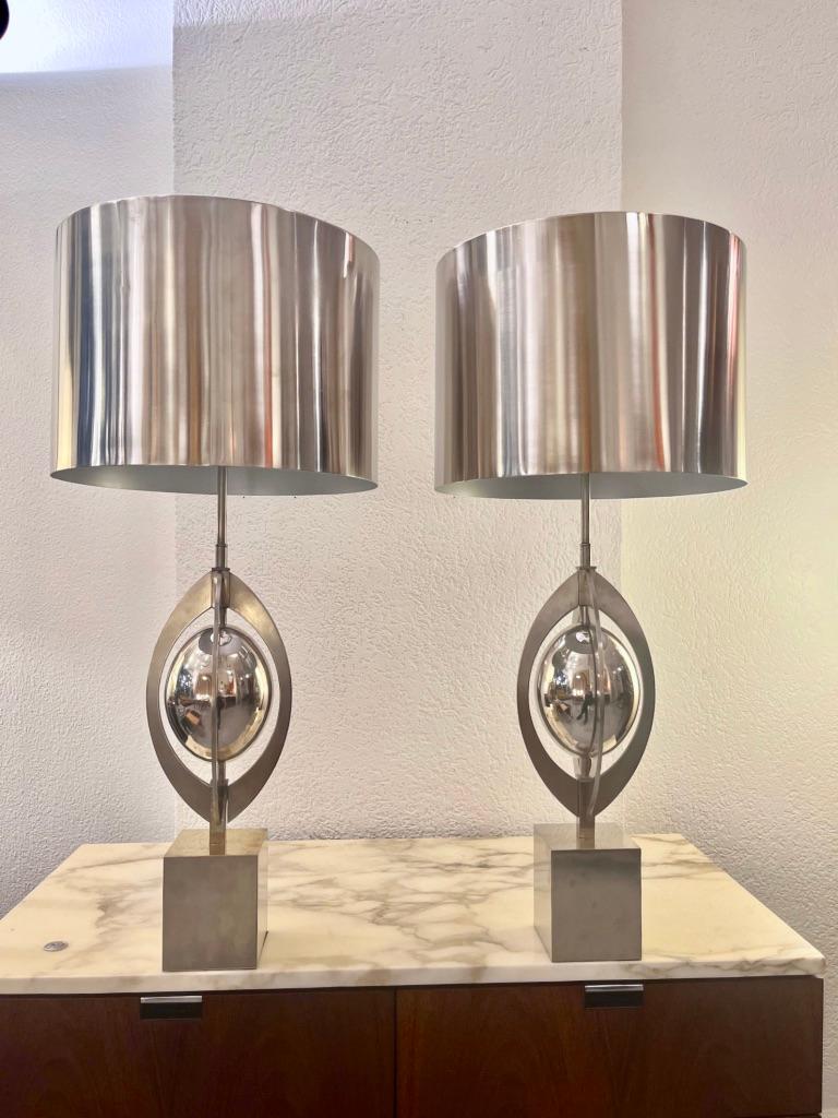 Pair of vintage brushed stainless steel table lamps Ogive by Maison Charles & Fils, France ca. 1970s
Very elegant. Original shades. Signed on the bottom ( Made in France, Charles & Fils )
3 bulbs on each lamp. 
H 78 x D 35 cm