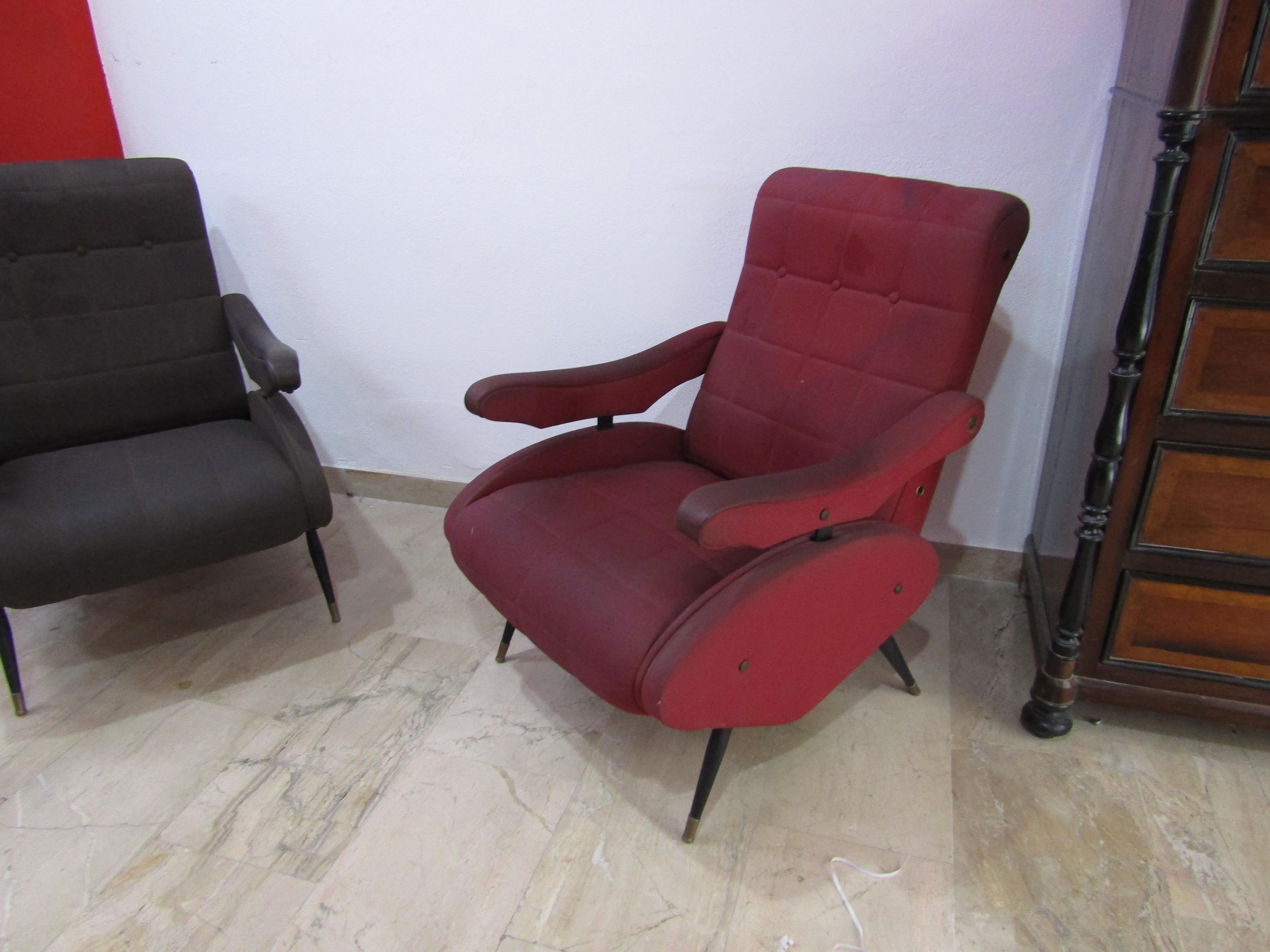 This pair of Oscar armchairs was produced by Novarredo in the 1970s and designed by Nello Pini in metal with black and red leatherette upholstery, the armchairs have small holes.