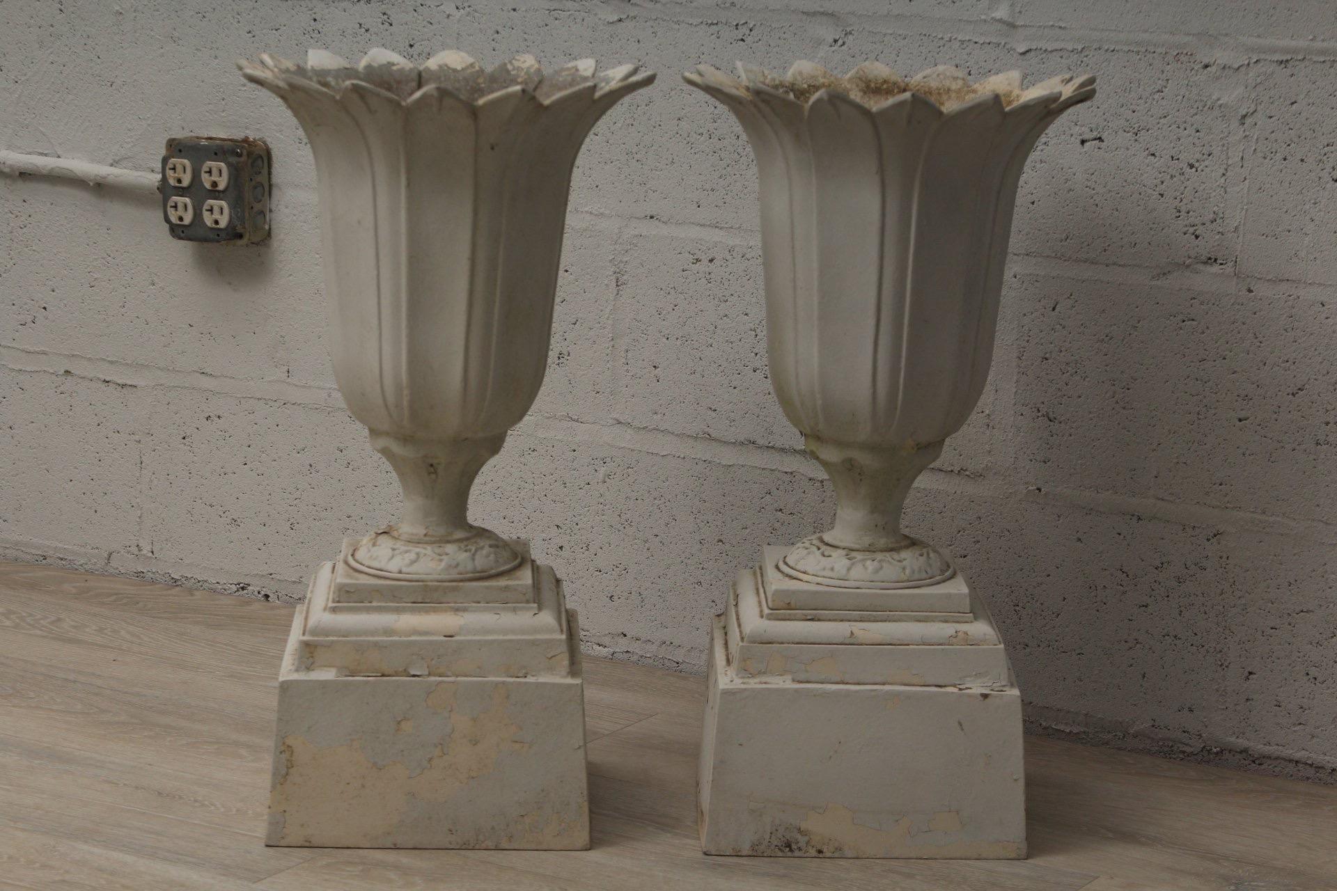 Pair of vintage aluminum urn planters in white. 

Imported, circa 1980-1990.

Dimensions: 28
