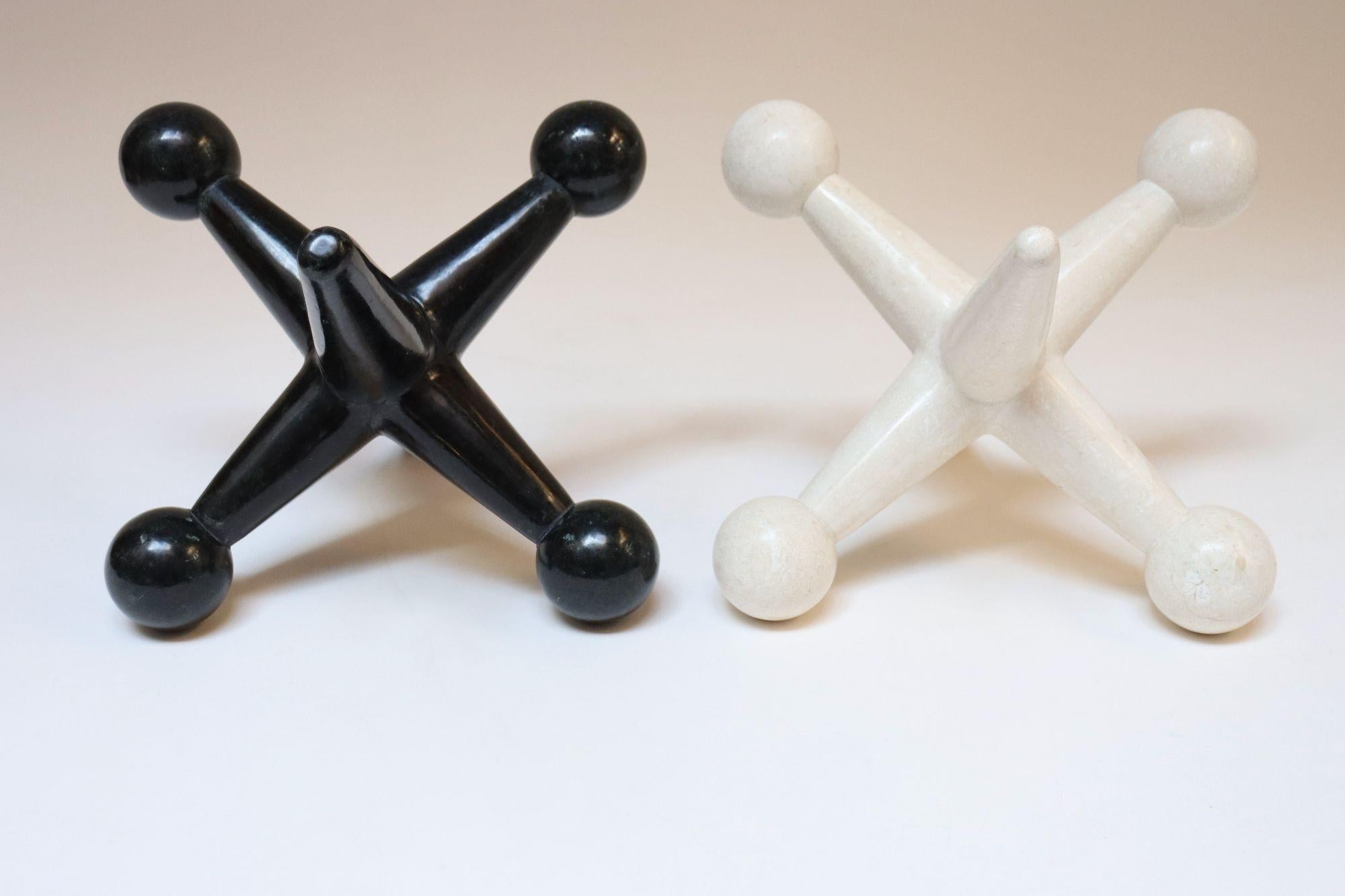 Pietra Coppia di sculture o reggilibri d'epoca in pietra tessellata Jax / Jacks in vendita