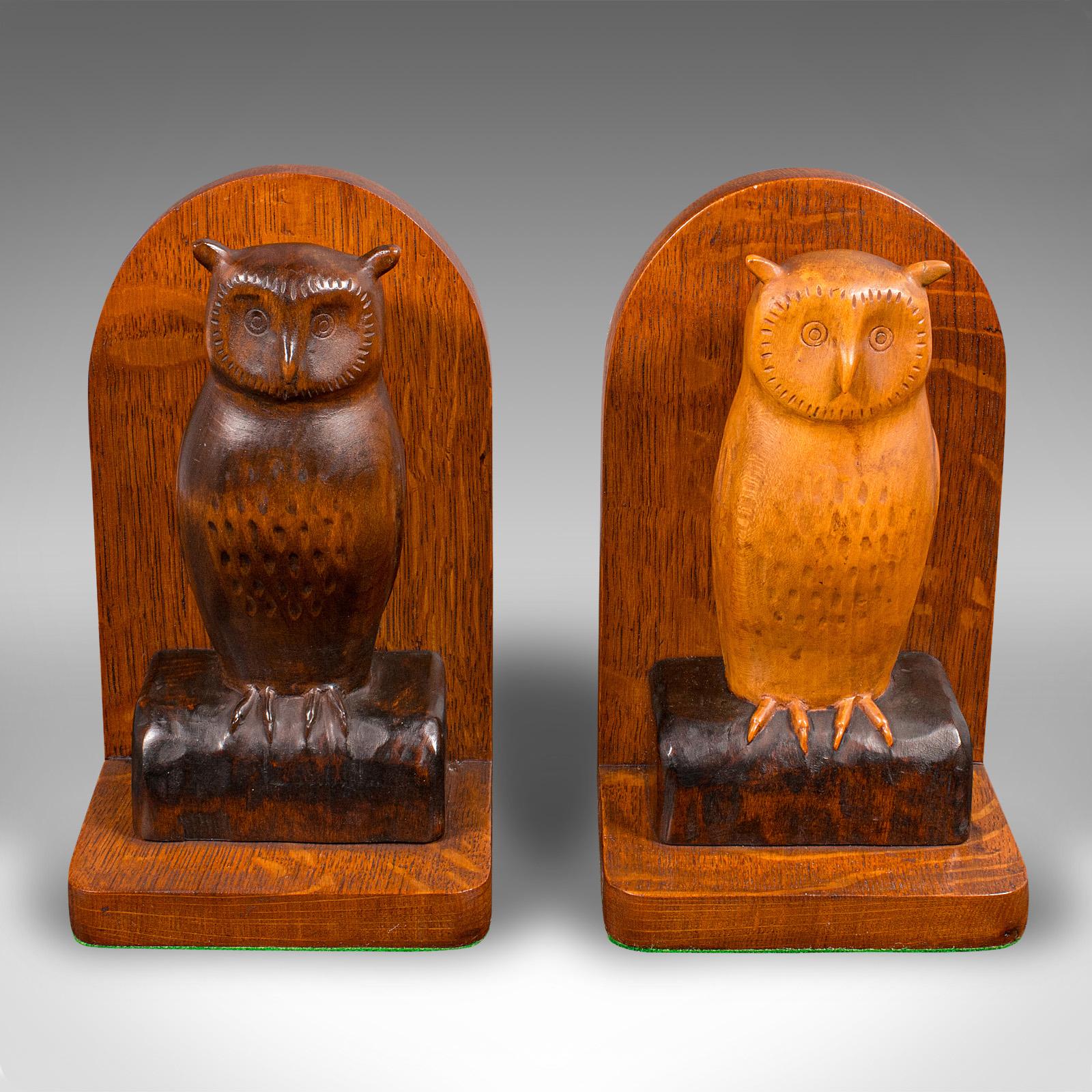 This is a charming pair of vintage bookends, featuring beautifully carved barn owls, crafted in appealing English oak, circa 1970. This decorative book rest combines warm caramel tones with a delightful avian theme, perfect for study, library, or