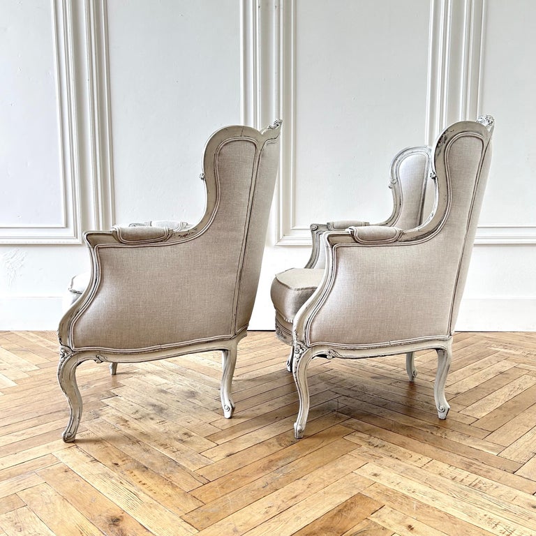 Pair of Vintage Painted and Linen Upholstered wingback Chairs For Sale